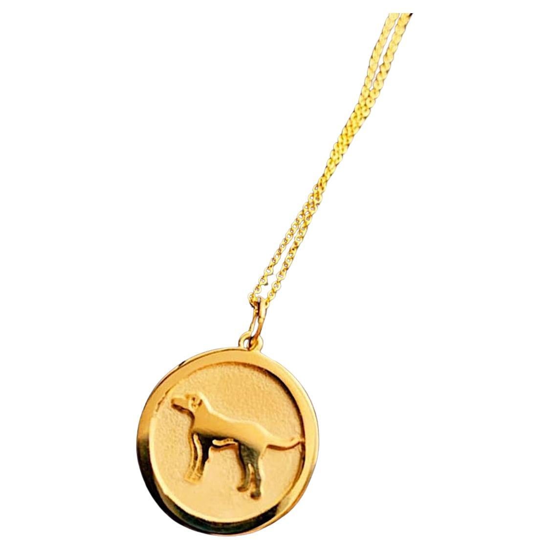 Piccolo ciondolo a forma di cane cinese in oro giallo 14 KT
