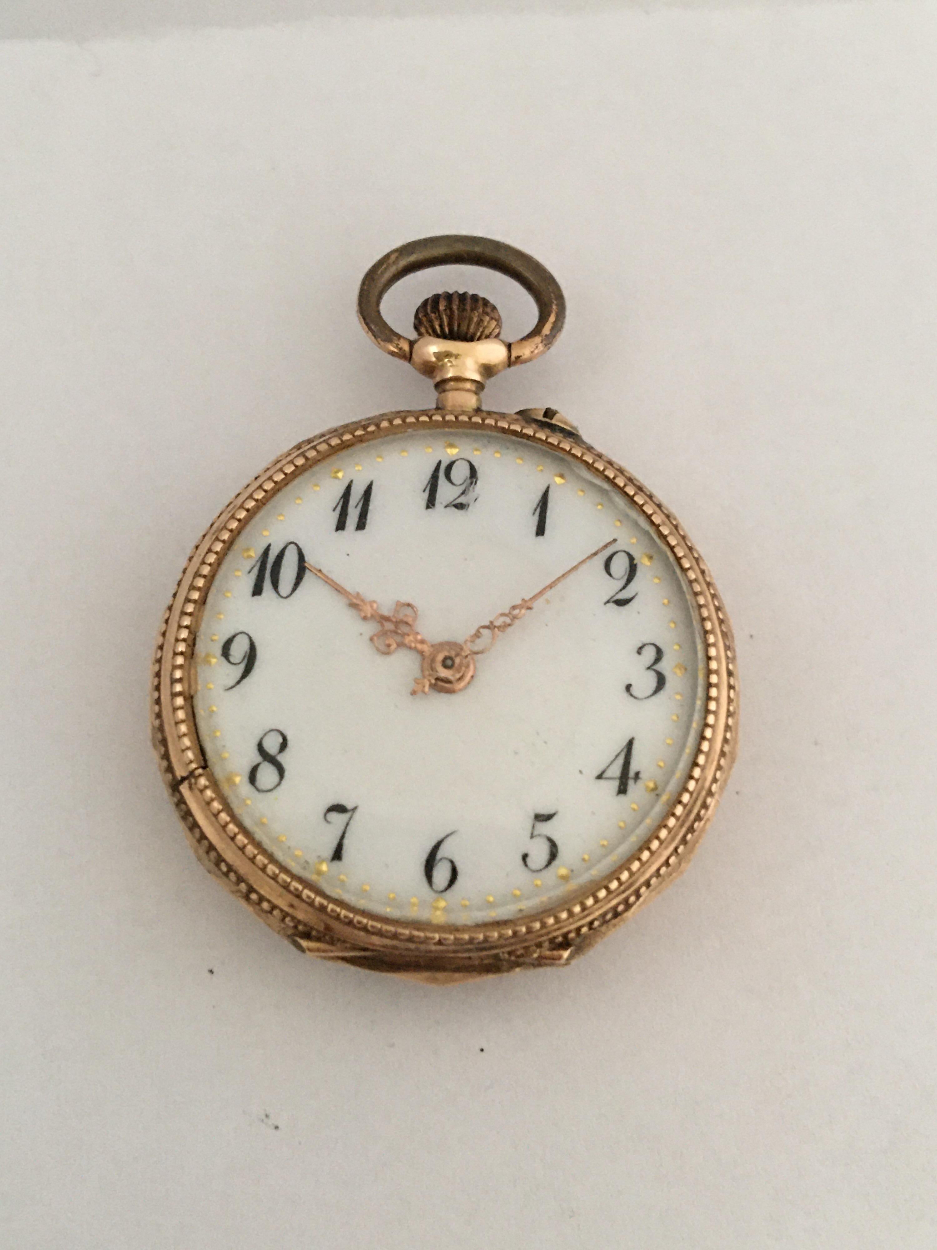 This beautiful 28mm diameter antique gold pendant watch is working and it is ticking well. Visible signs of gentle used with tiny scratches on the glass and tiny dents on the gold back case. A smooth running key-less and pin set Swiss Movement. This
