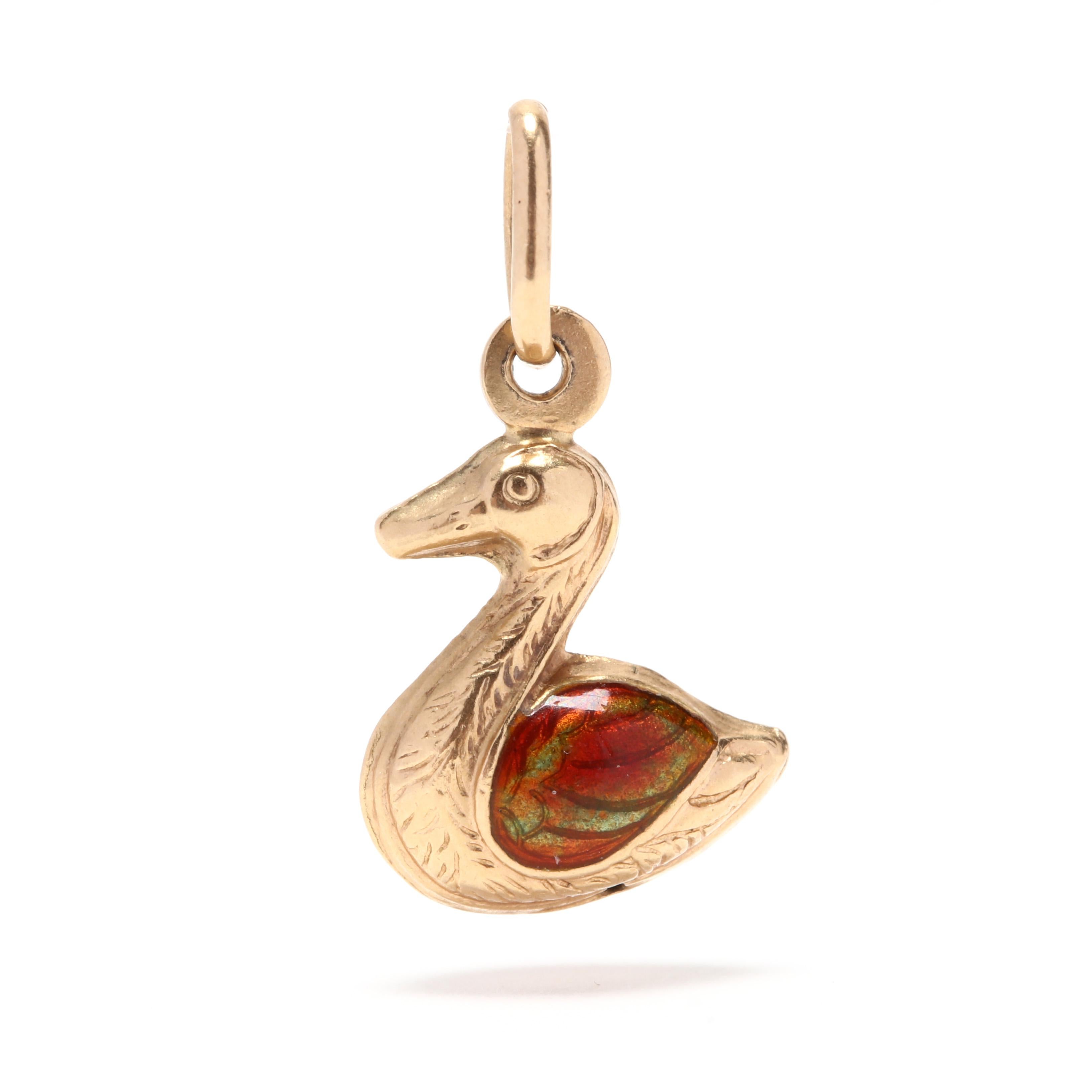 A small 14 karat yellow gold and enamel duck charm / pendant. This charm features a three dimensional, puffed duck motif with green and red enamel wings.

Length: 7/8 in.

Width: 1/2 in.

.85 dwts.

* Please note that this is a vintage item and may