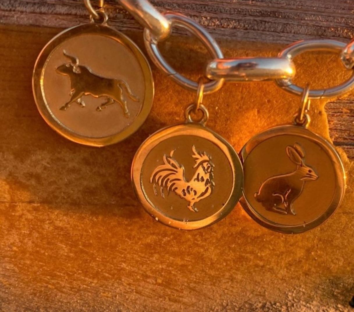 Our Chinese Zodiac Collection. Each of the twelve Zodiac Animals, whether moving forward or standing tall, was designed to impart strength and resilience.

This Rooster Medallion is hand-carved in wax and cast in 14kt gold. The Rooster Medallion