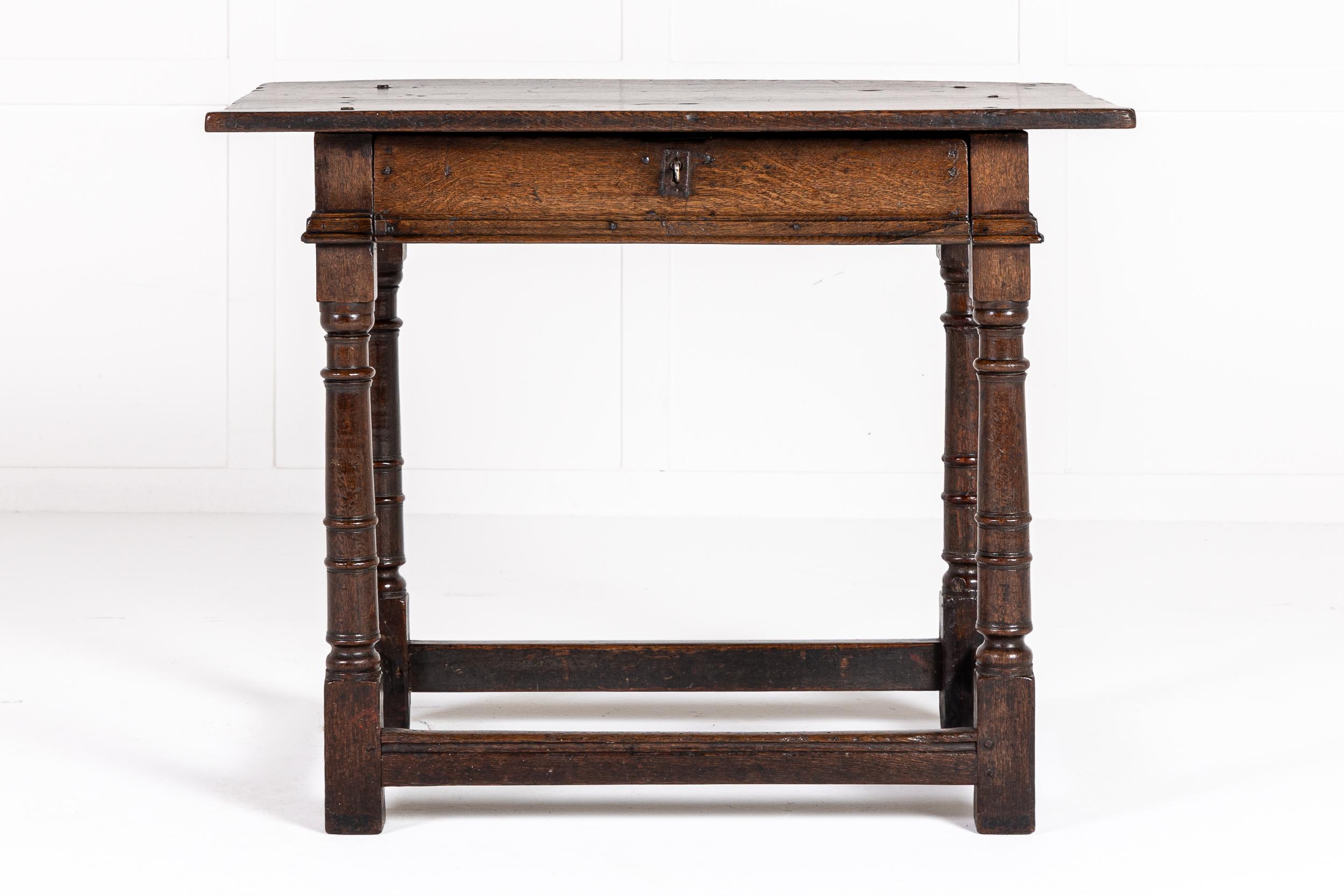An Attractive 17th Century English Oak Side Table of Small Size and Good Colour. Circa 1680.

This piece is a great example of a provincial oak side table from the late 17th century. The top is made of two planks which overhang the base. The base