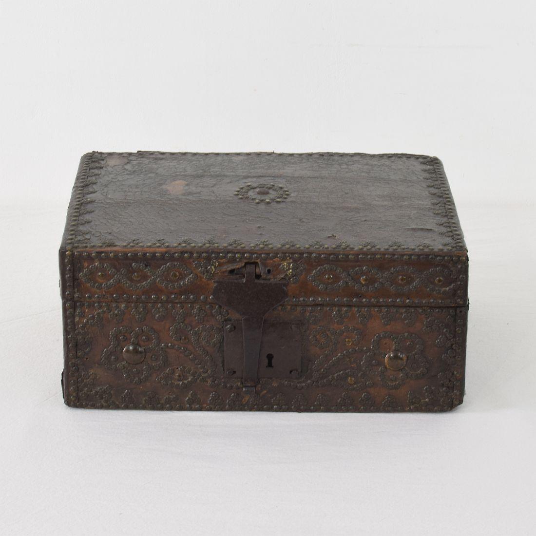 Extremely old box that is covered with leather and decorated with iron and brass. Rare find. France, circa 1600-1700
Weathered, some losses and old repairs.
  