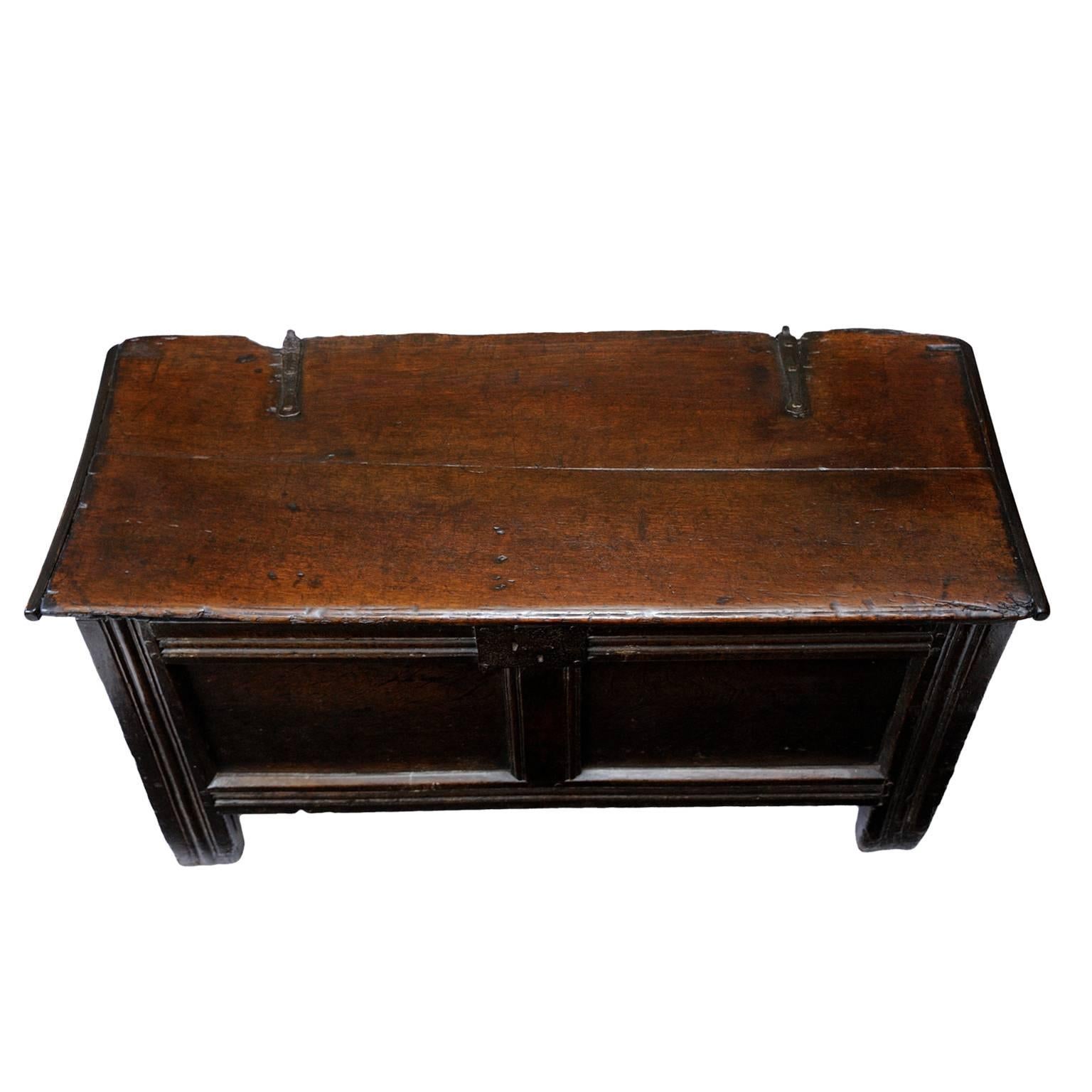 This is a rather charming small 17th century oak coffer. The base is made of panel construction with decorative moulding on the stiles, circa 1680.