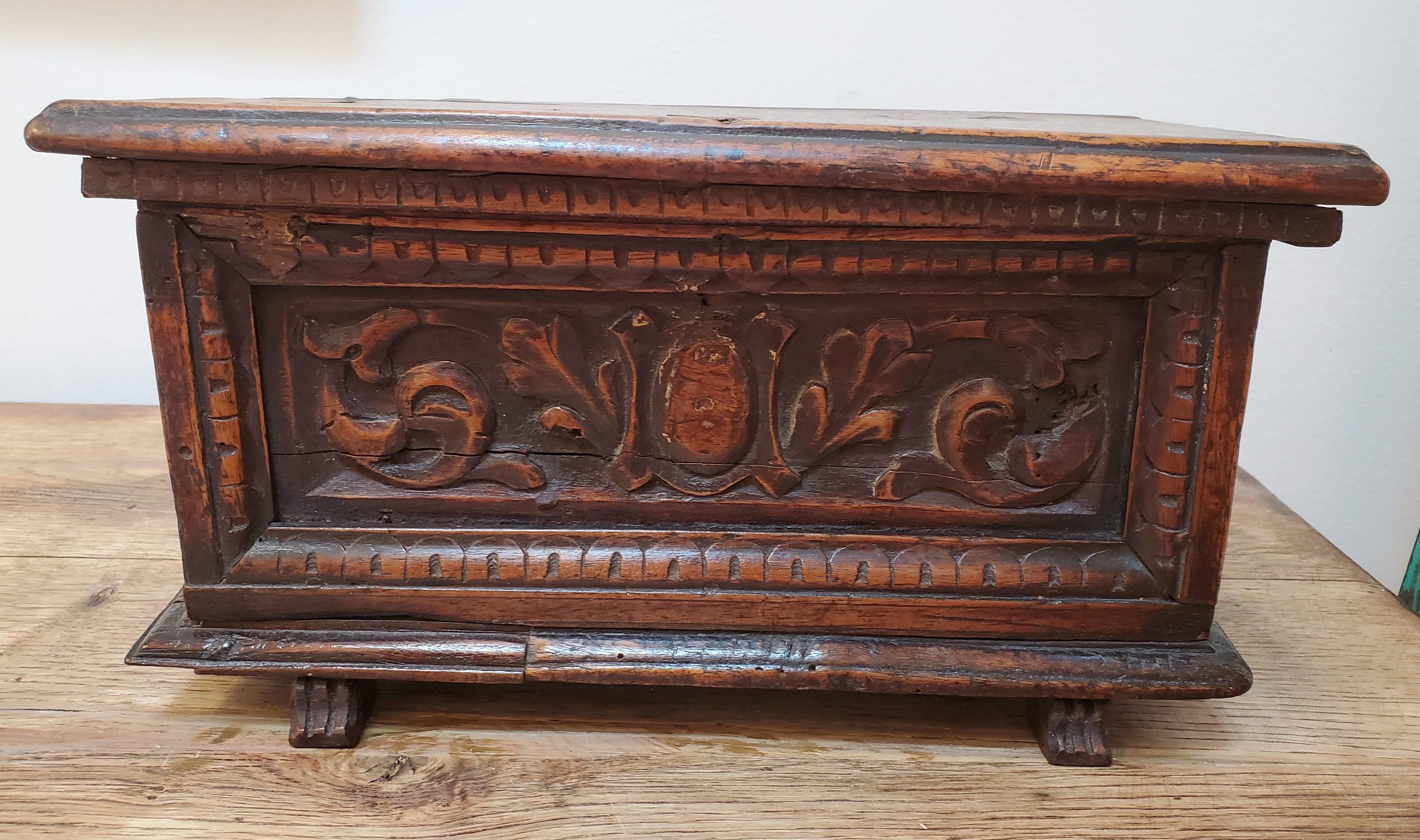 Add this uniquely small late Italian renaissance cassone (or marriage chest) to your collection for bit of historic sophistication. With centrally carved panel over molded base and carved feet, this box, made of Circassian walnut with a deep