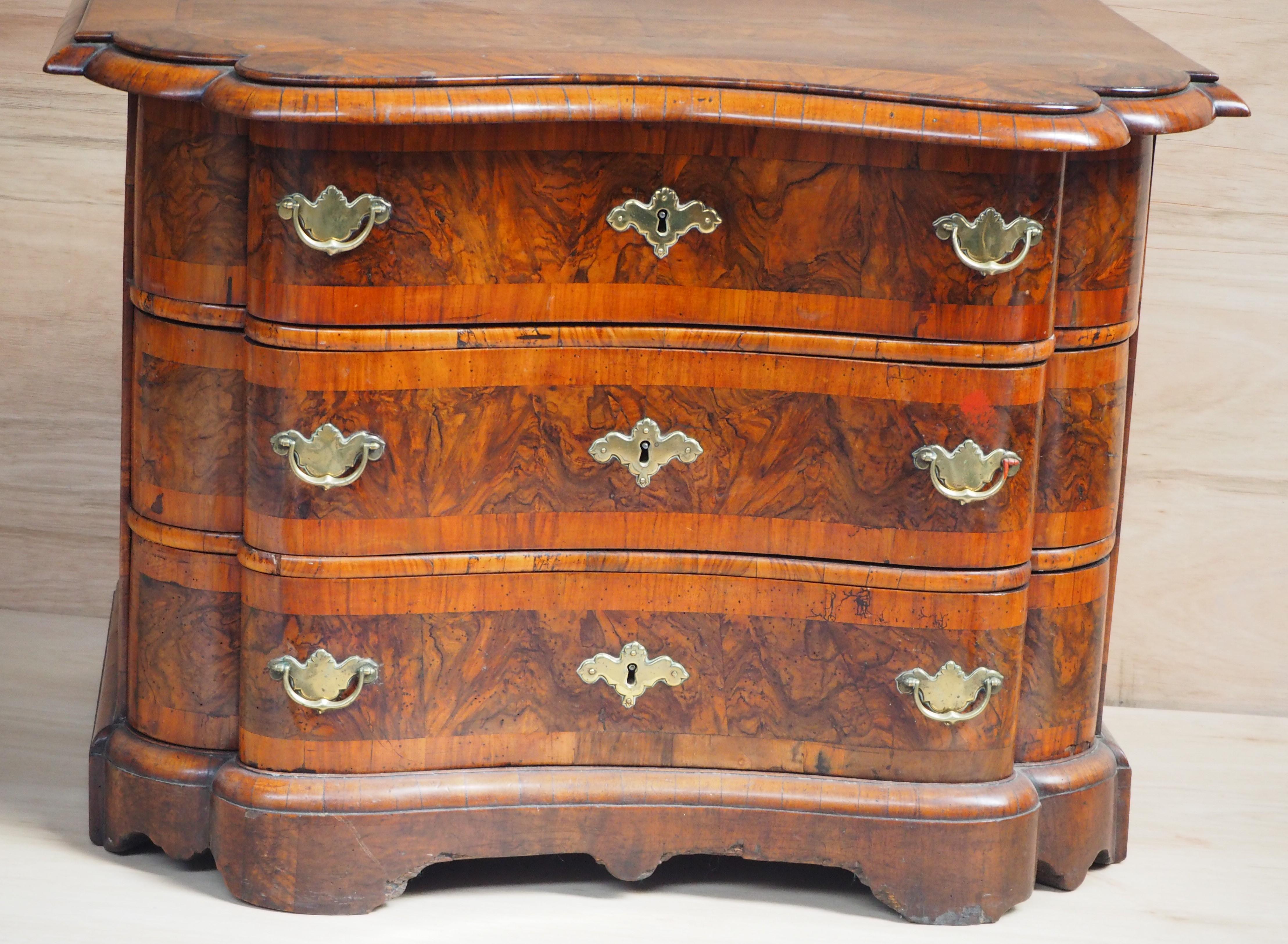 This small Baroque Venetian Commode/Chest of three long drawers is of good proportions, has a strong burl walnut of good colour and patina.,  A good and useful height with three commodious drawers.  With the original working locks . .
More