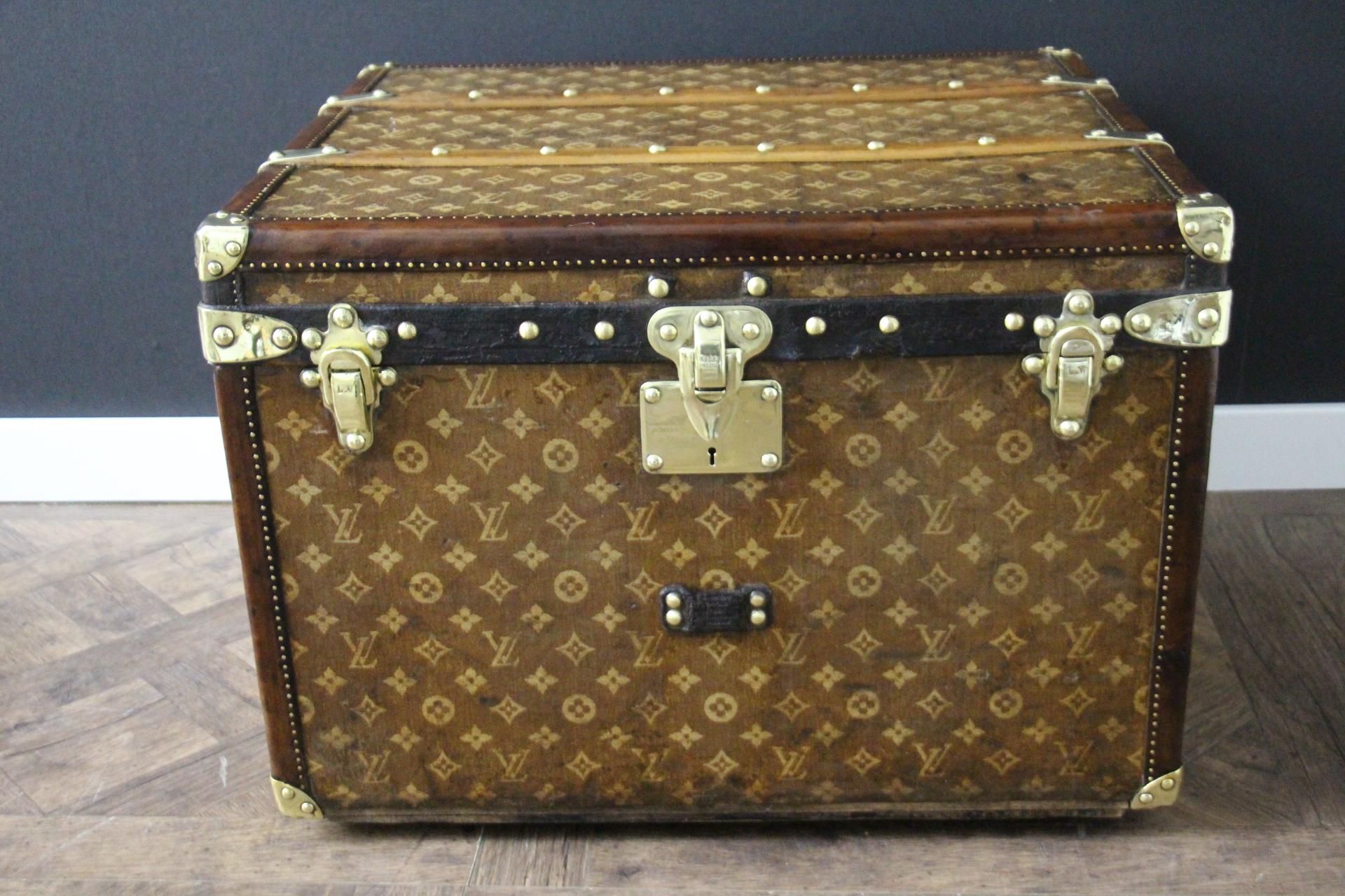 This lovely little Louis Vuitton steamer trunk features the very sought after  monogram woven canvas, leather trim, solid brass corners, solid brass locks, and side handles. Its brass locks, studs and side handles are all marked Louis Vuitton.
It