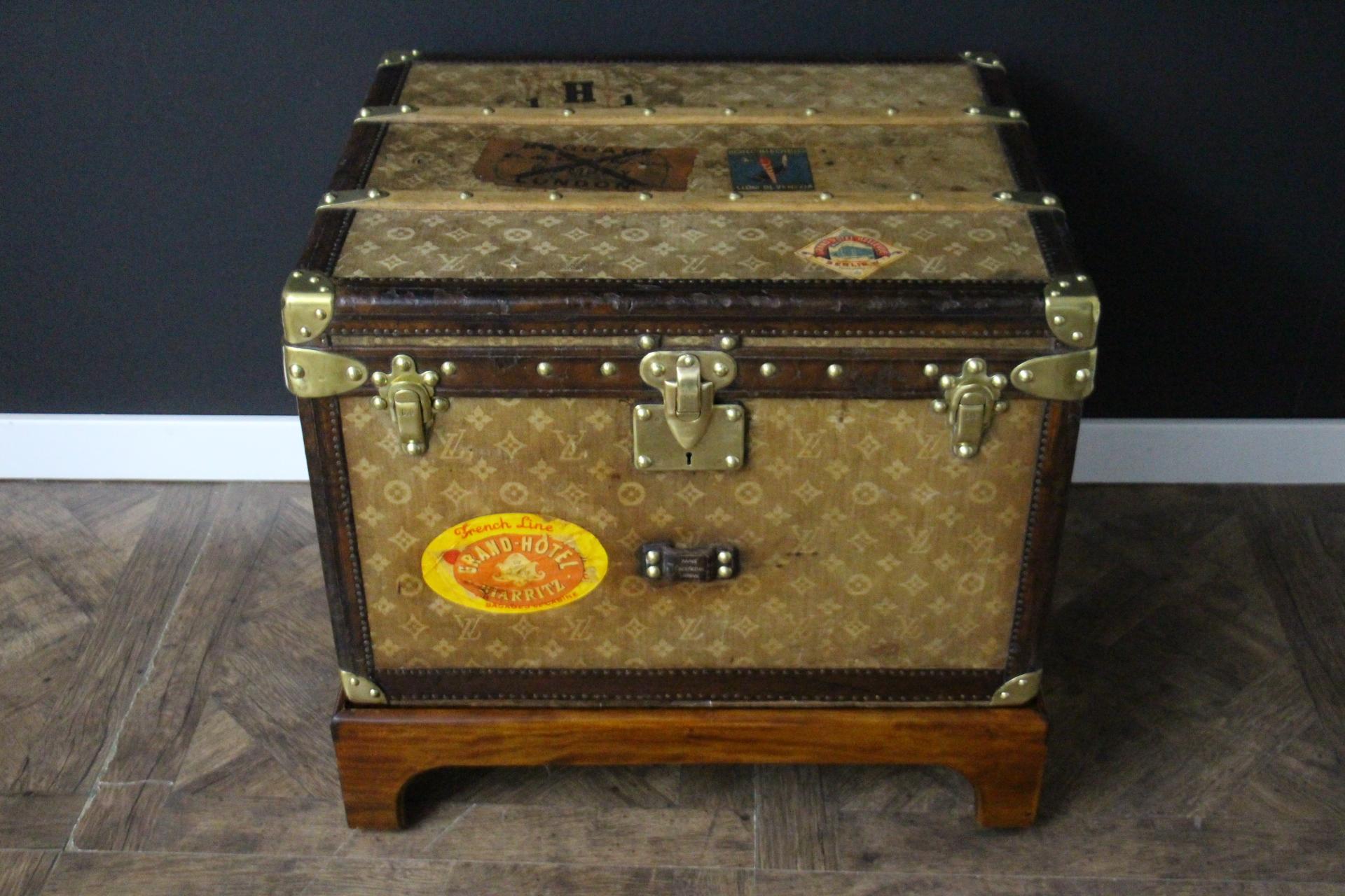 This lovely little Louis Vuitton steamer trunk features the very sought after  monogram woven canvas, leather trim, solid brass corners, solid brass locks, and side handles. Its brass locks, studs and side handles are all marked Louis Vuitton.
It
