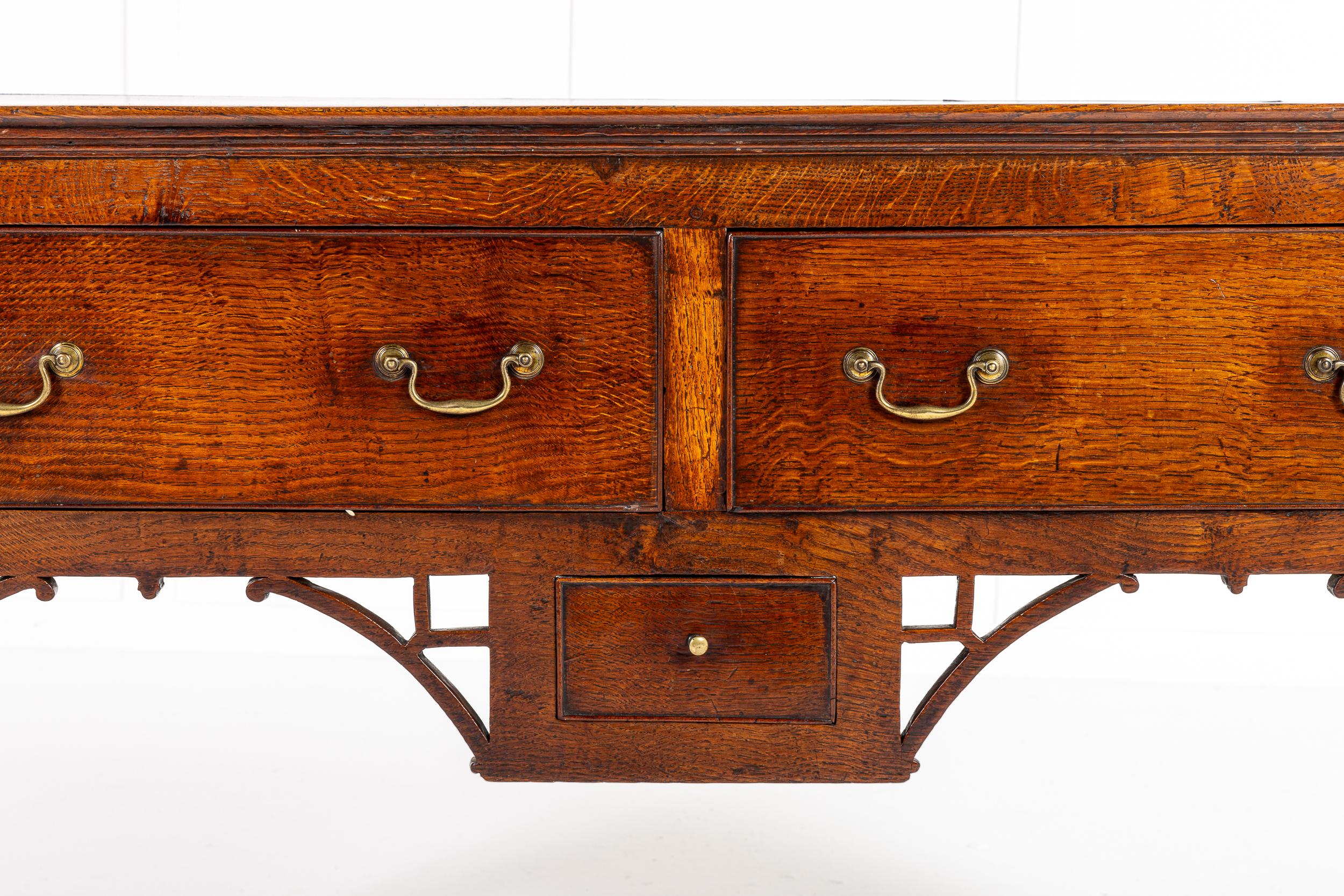 A Small Scale Late 18th Century English Oak Dresser Base with Chinoiserie Brackets in the 