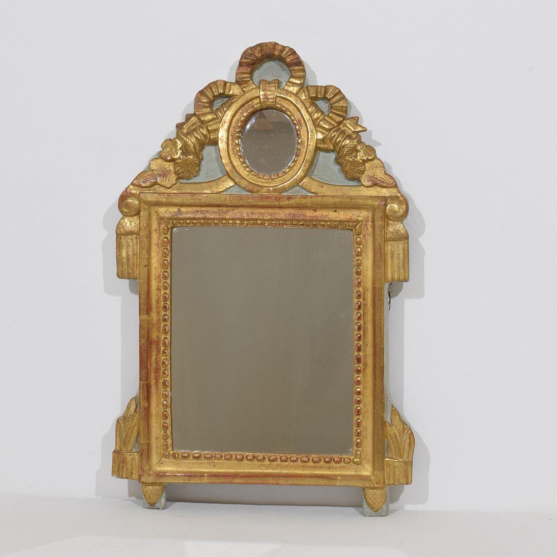 Small giltwood Louis XVI style mirror. Beautiful period piece.
France, circa 1760-1790.
Weathered, small ,losses and old repairs.