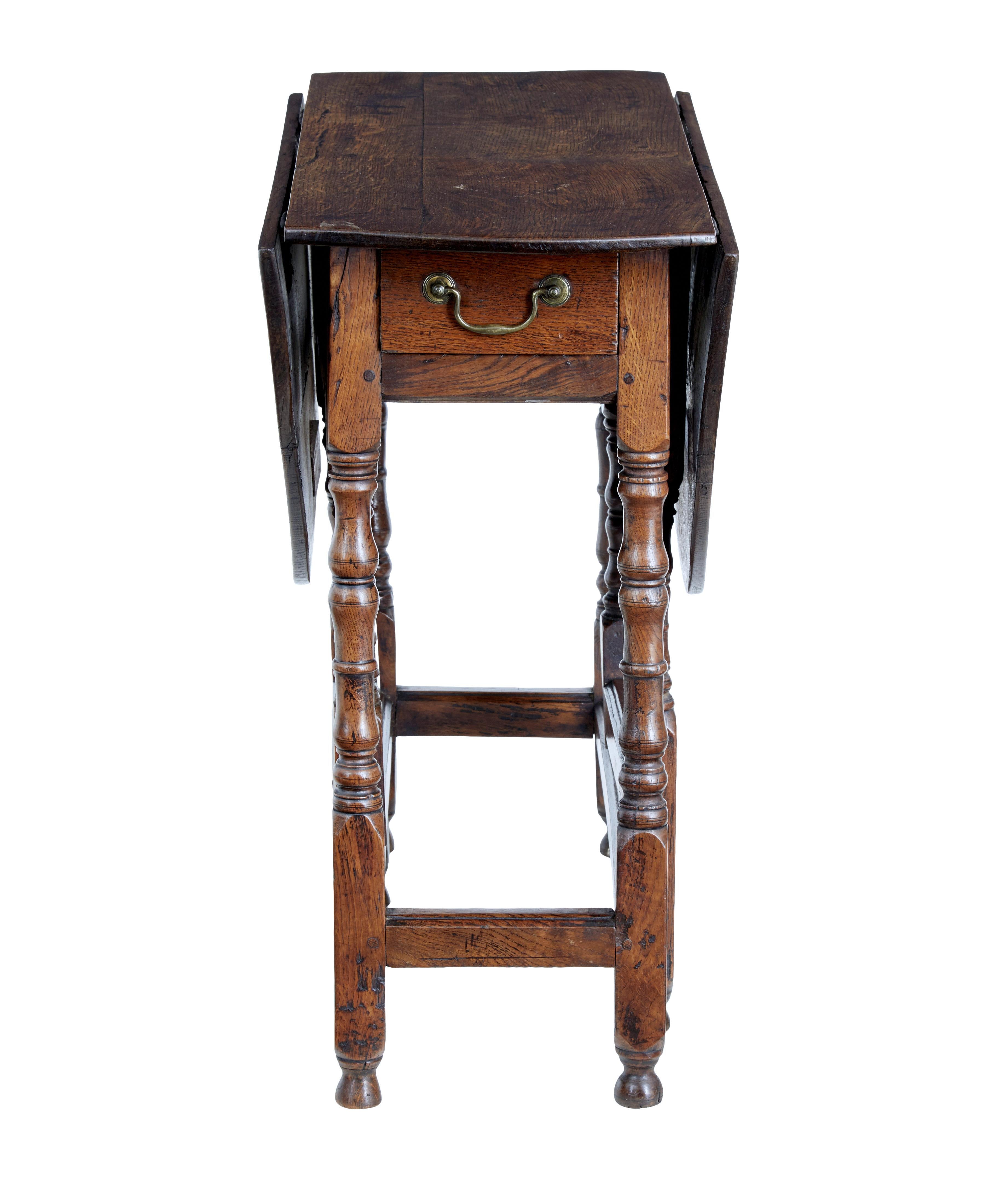 Small 18th century Georgian oak gate leg table circa 1780.

Delightful piece of English furniture which is not too far away from it's 250th birthday.

Made in oak, drop leaves on hinges lift up with the leg supports to form a surface of 34 1/2