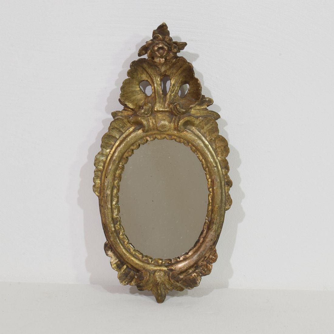 Lovely small weathered Baroque hand carved mirror, Italy, 18th century. 
Weathered, small losses and old repairs.