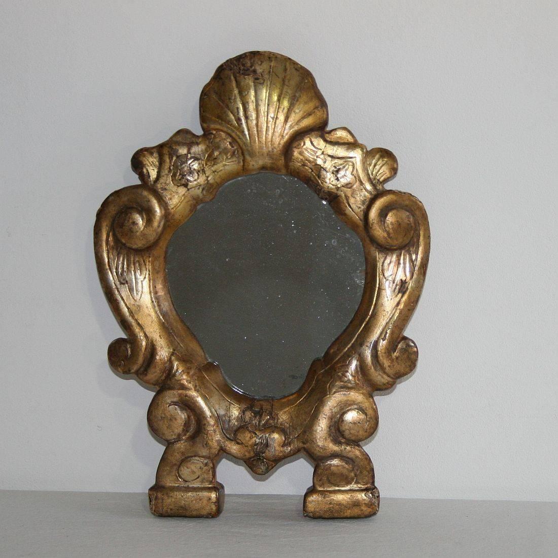 Although not in the best condition, very nice small Baroque giltwood mirror, Italy, circa 1750. Weathered, small losses and old repairs.