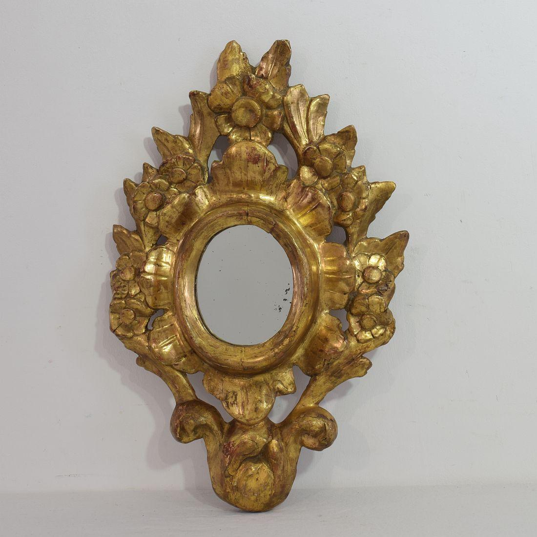 Well carved small giltwood Baroque mirror. Gorgeous small piece, Italy, 18th century. Weathered, small losses and old repairs.



 