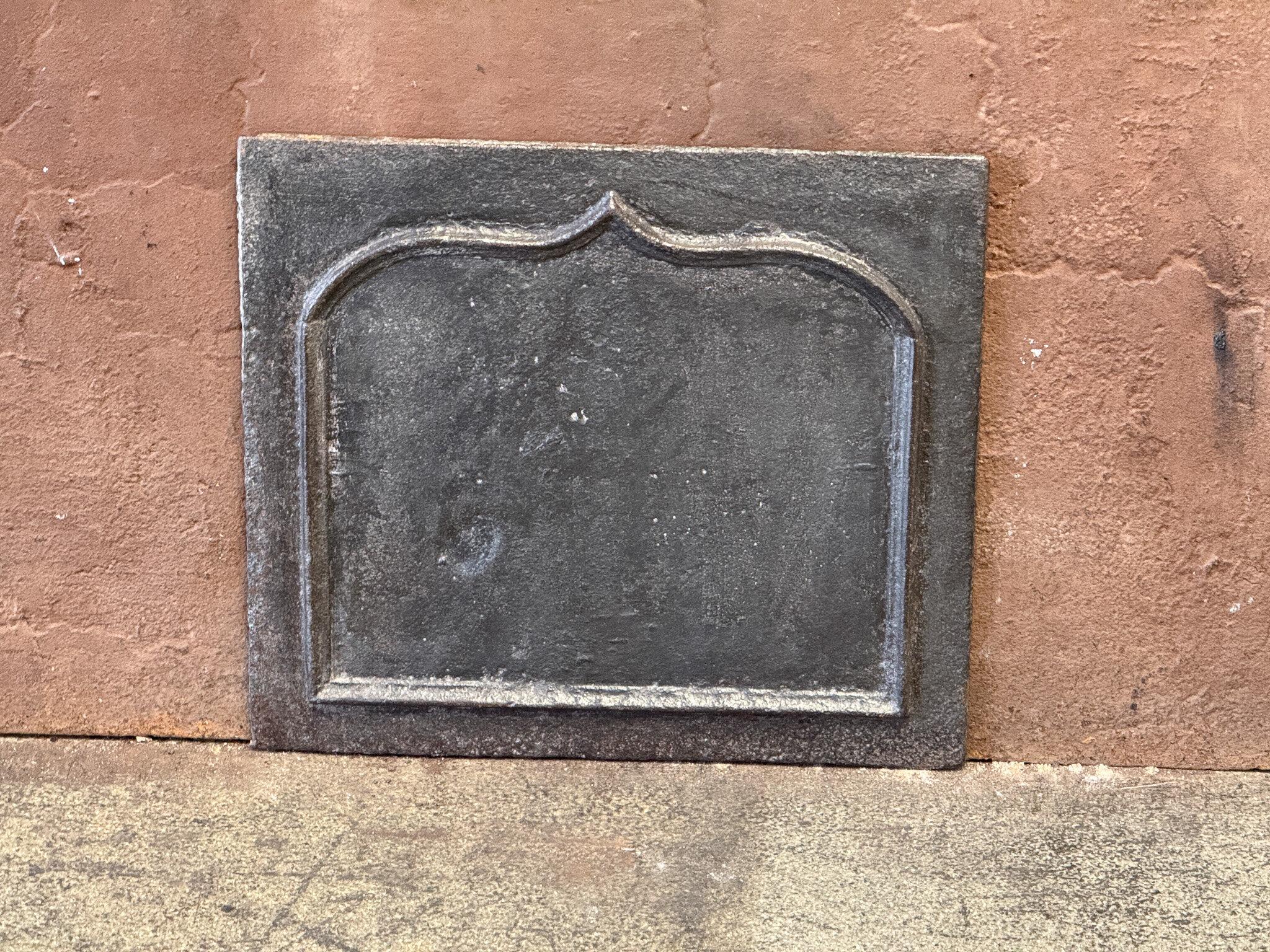 18th century French Louis XV Period fireback with a Louis XV decoration. 

The fireback is made of cast iron and has a natural brown patina. Upon request, it can be made black/pewter colored with stove polish at no extra cost. It is in good