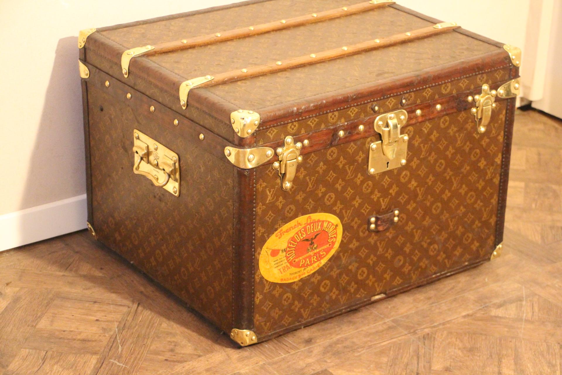 This lovely little Louis Vuitton steamer trunk features stenciled monogram, leather trim, solid brass corners, locks, and side handles. Its brass locks, studs and side handles are all marked Louis Vuitton.
It has got a very warm patina. It has got