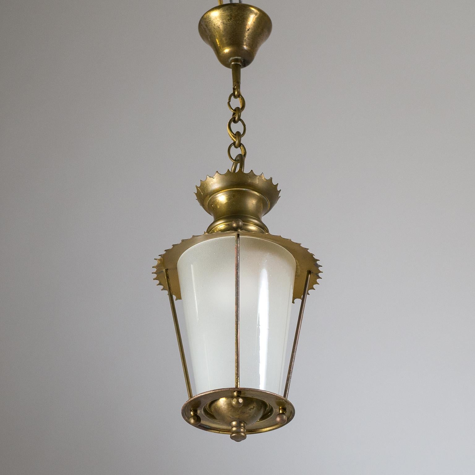 Charming petite French midcentury brass and glass lantern. The conical glass diffuser is frosted on the inside and held by all brass hardware with nice scalloped rims. Fine original condition with patina on the brass. One brass and ceramic E14