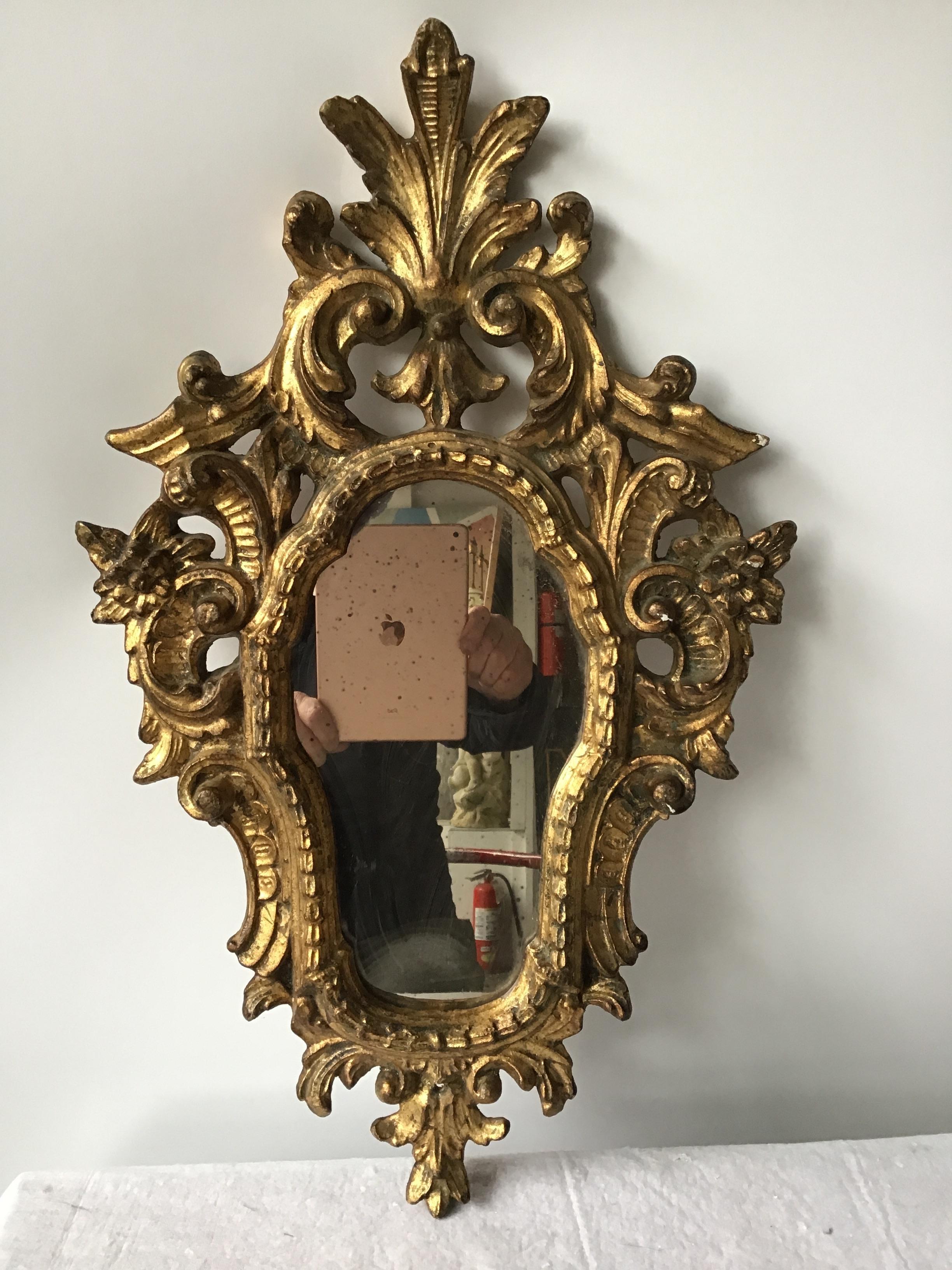 Small 1950s Italian hand carved giltwood mirror.
This item can be shipped via UPS.