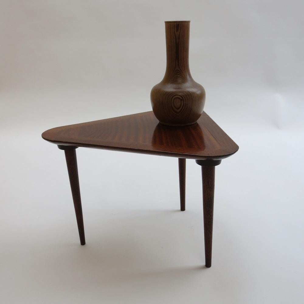 Midcentury Handmade small side table. Very stylish table, dating from the 1950s, made with veneered Mahogany top, solid Mahogany legs and edge of top. In good vintage condition, signs of wear over all. 
This piece has been handmade and was probably