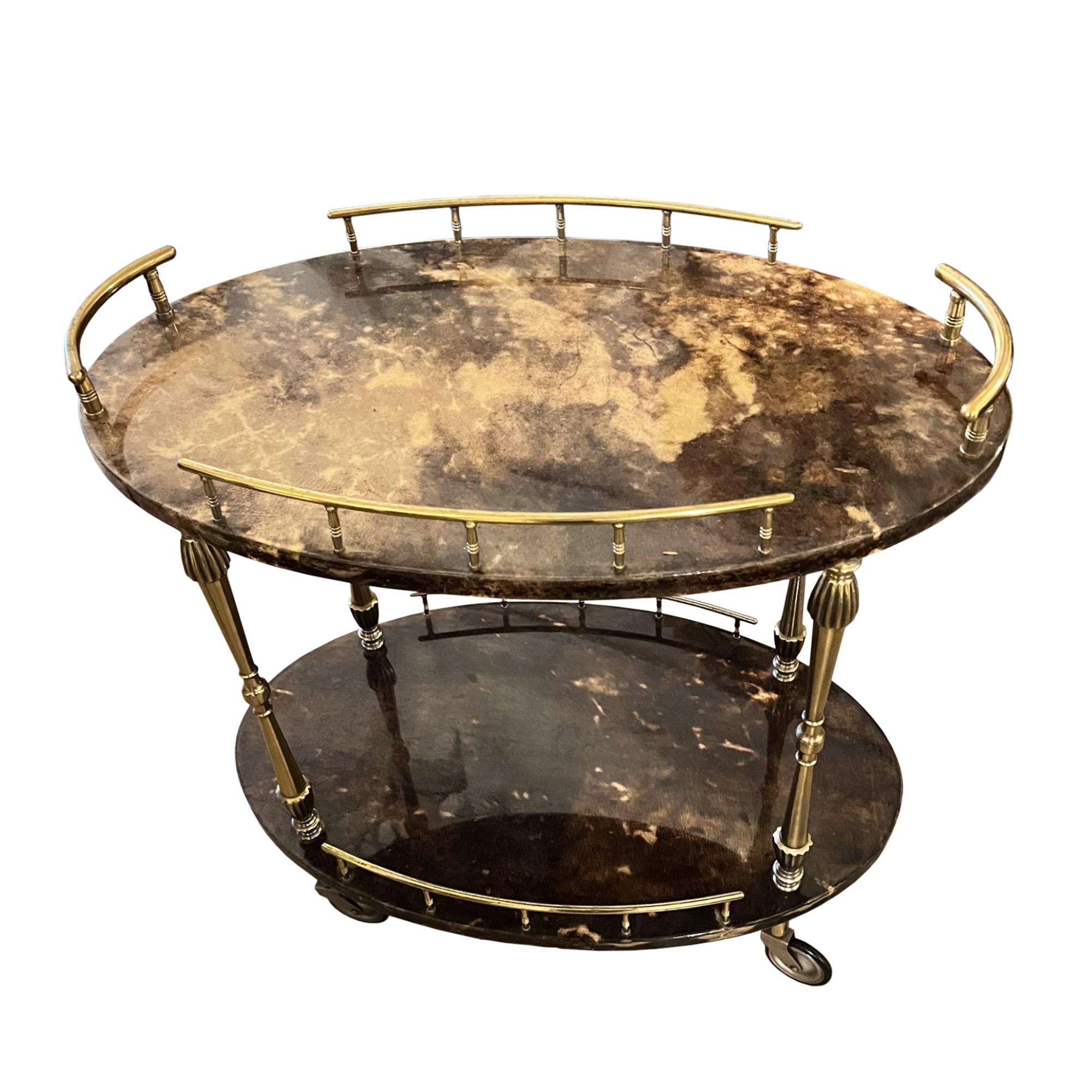This wonderful lacquered goatskin and brass mid century drinks trolley was designed in Italy by Aldo Tura. His use of goatskin makes each piece unique. 

This is a lovely smaller model - if you're looking for a larger one - do get in touch as we