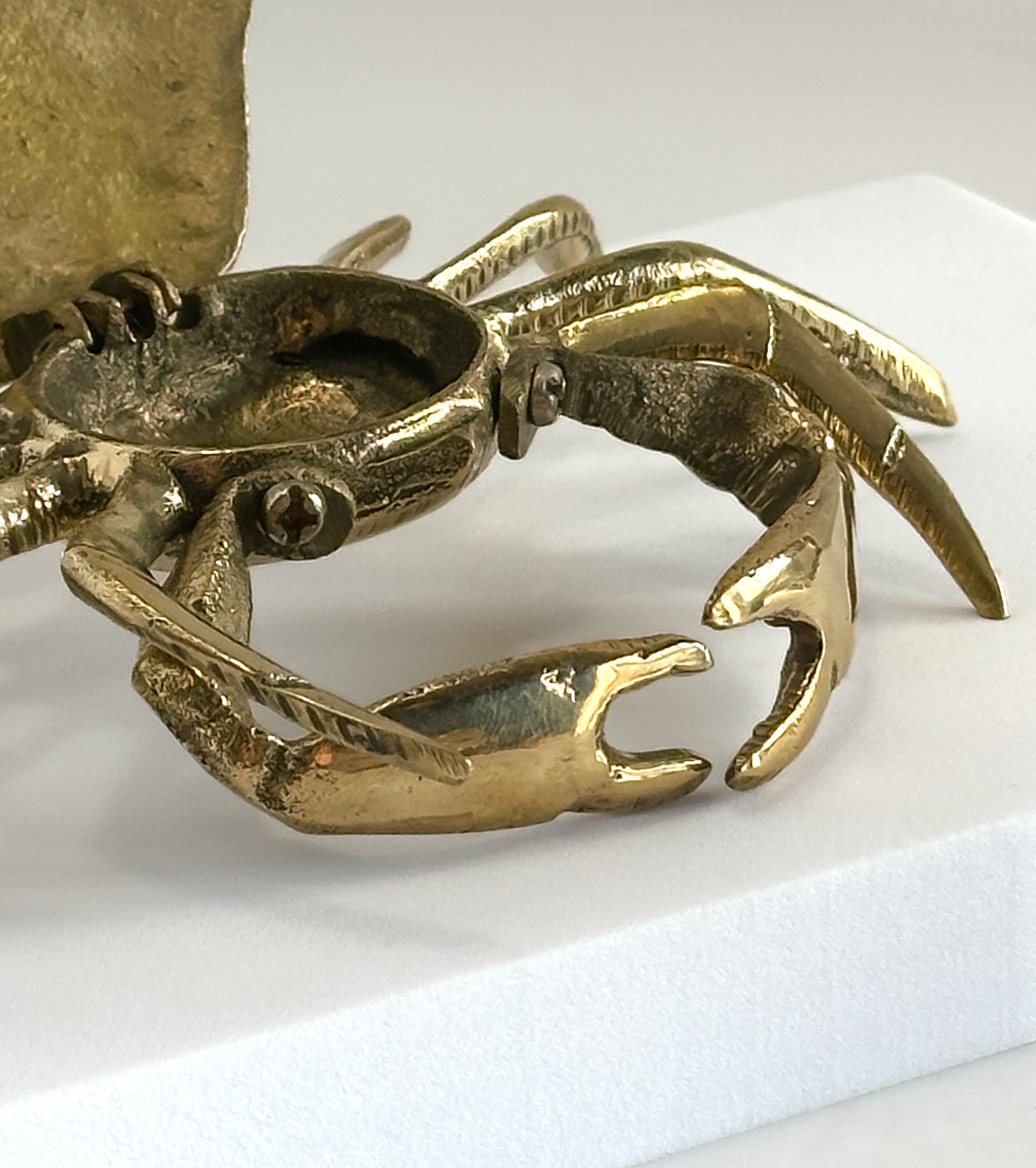 A polished brass ashtray/trinket box, cast in the shape of a crab. Crafted in Italy around the 1960s, it's a kitsch and interesting piece of functional decor…

 The crab has been cast in brass and polished to a mirror shine. The body is in one