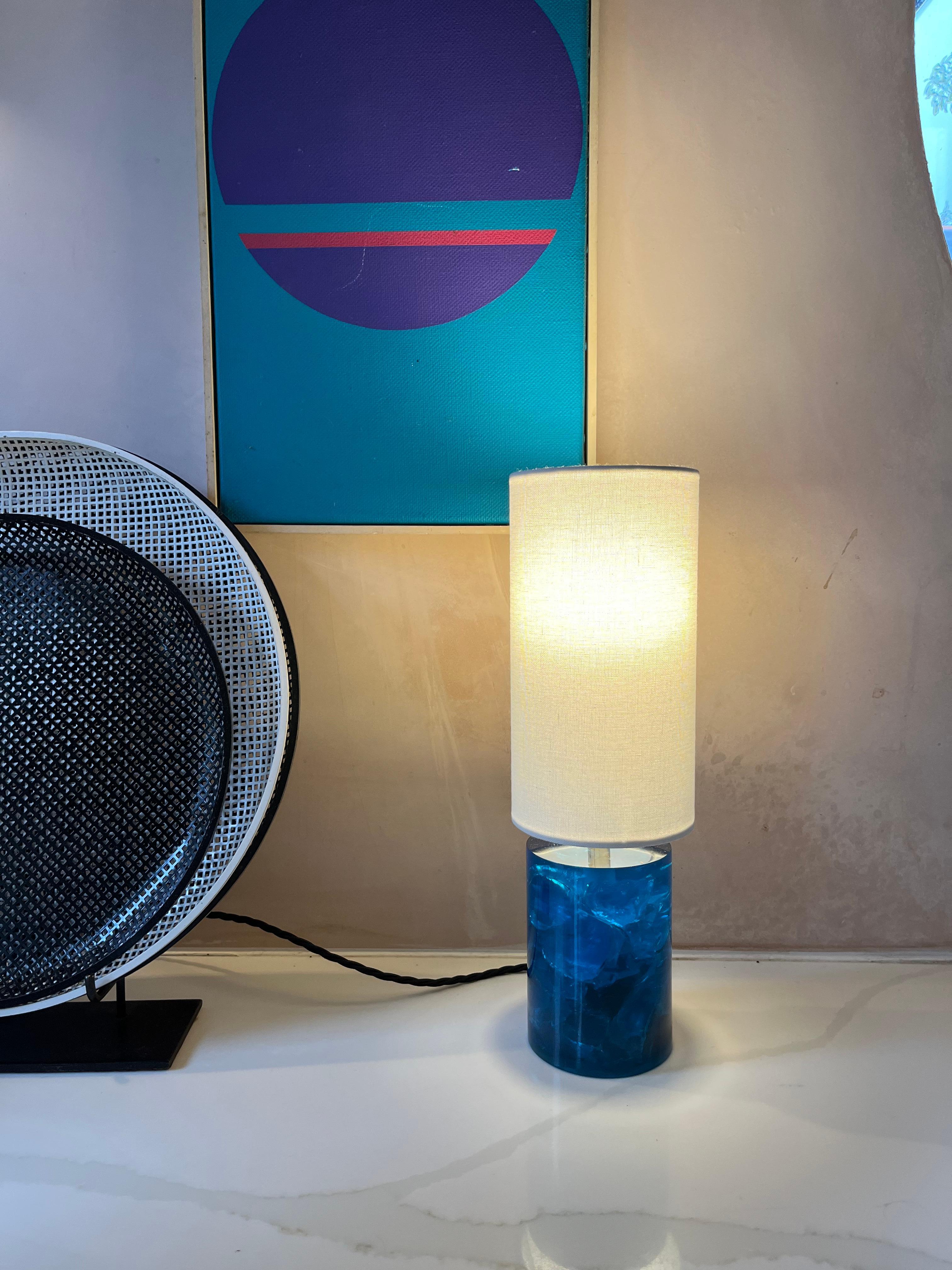 A turquoise resin small vintage table lamp. Rewired and sold with shade.