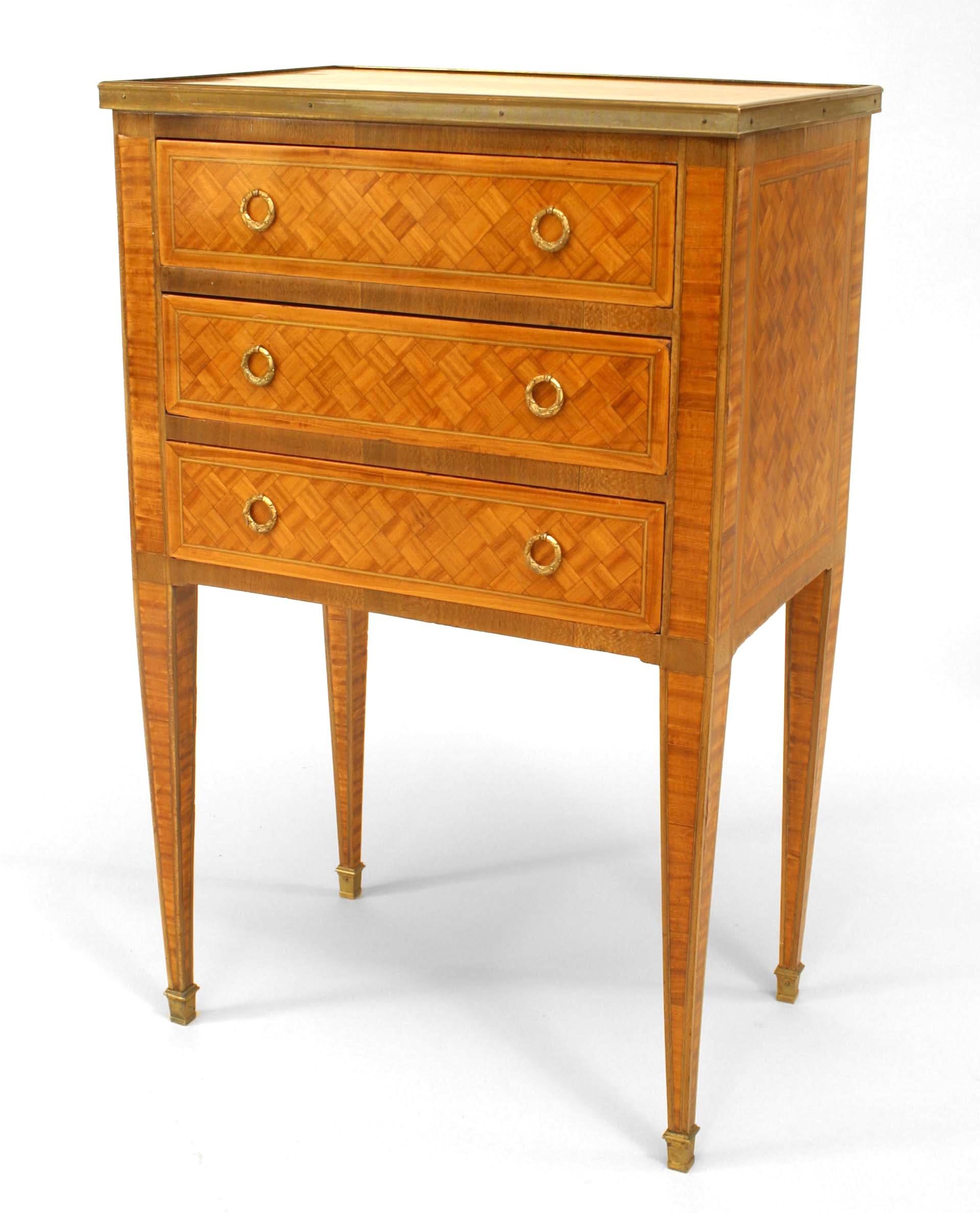 French Louis XVI-style (19th Century) satinwood and parquetry inlaid small commode with three drawers and gilt bronze trim.
