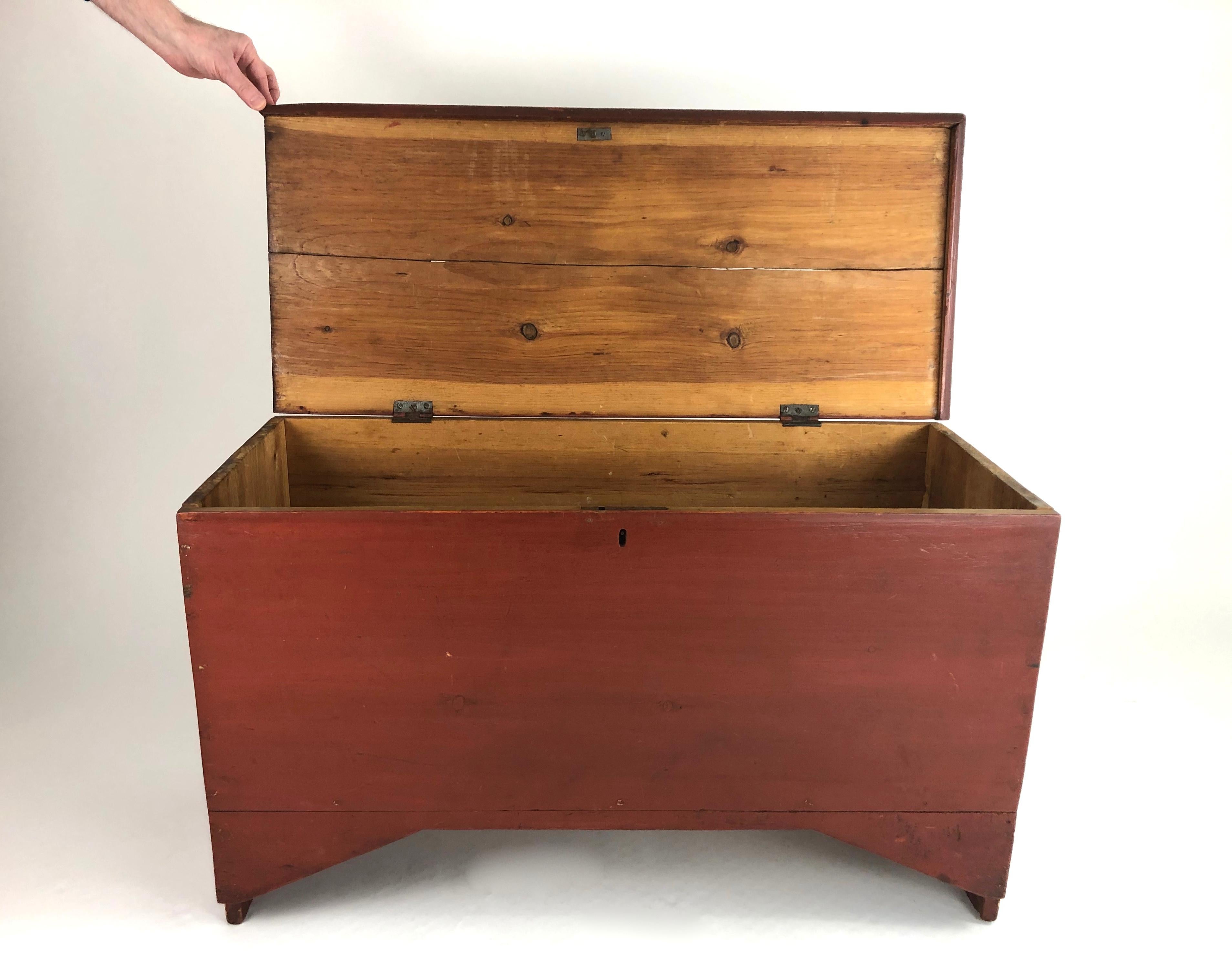A 19th century American small scale six board red painted blanket chest with bread board top and boot jack ends, with a shaped, angled apron. Solid and versatile small size.



  