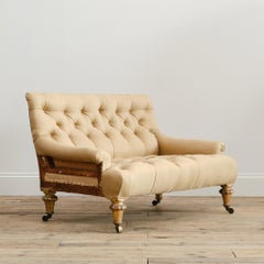 Small 19th century buttoned sofa on Gilt legs