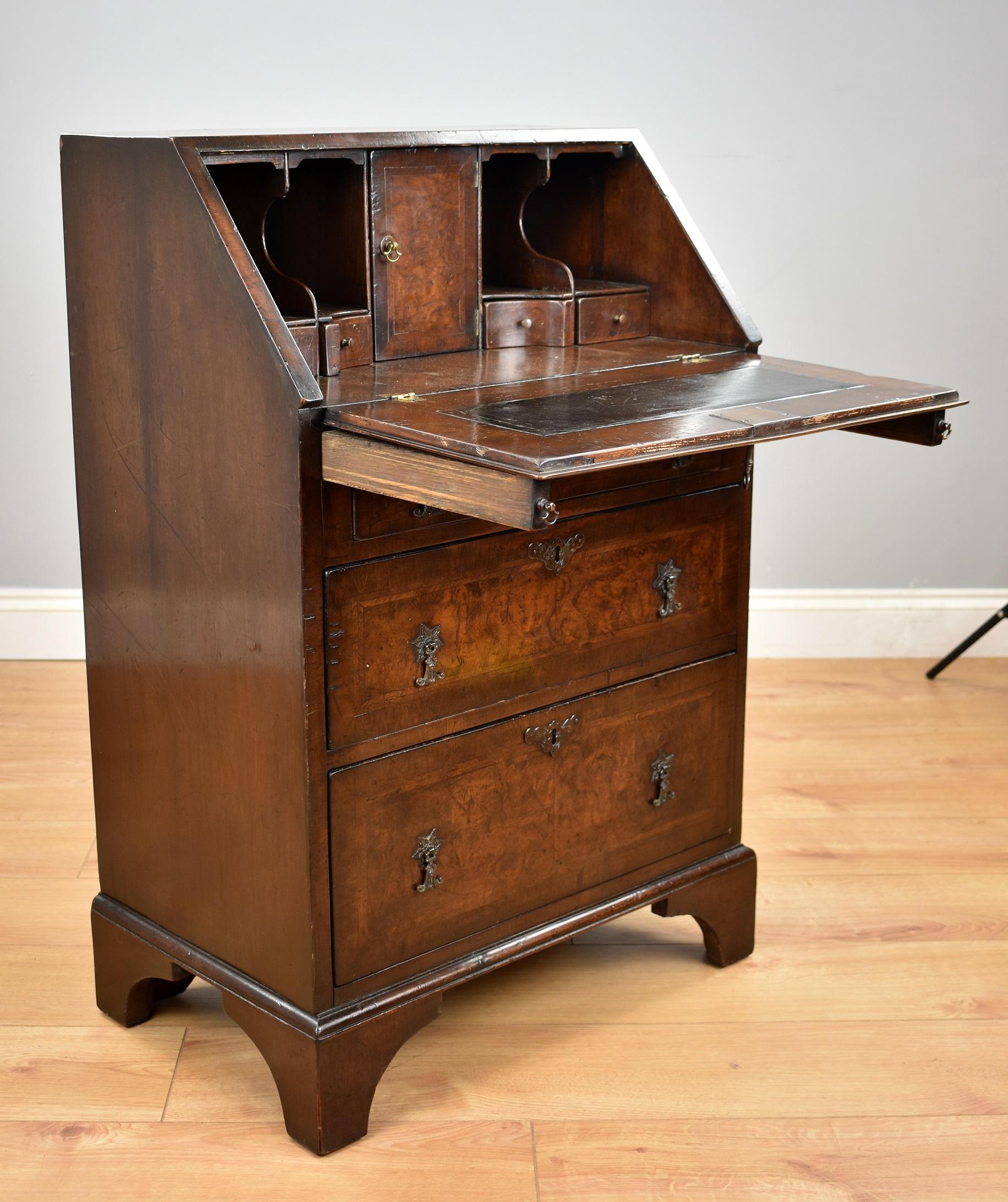 For sale is a good 19th century burr walnut bureau of small proportions. The top having walnut banding as well as herringbone inlay. Below this, the fall also has walnut banding and inlay, opening to reveal a fully fitted interior comprising shaped