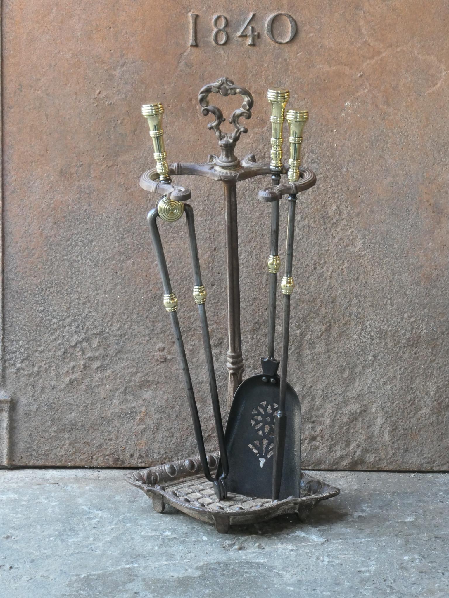 Small 19th century English Victorian period fireplace toolset. The tools are made of wrought iron with brass handles, while the stand is made of cast iron. The toolset consists of tongs, poker, shovel and stand. The condition is good.








.