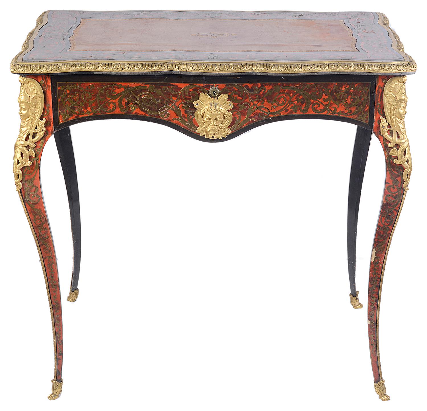 A good quality small late 19th century French Boulle inlaid bureau plat, having an inset leather top, brass inlay and tortoiseshell to the top, frieze and legs, gilded ormolu mounts, a single frieze drawer with a Bramah lock and raised on elegant