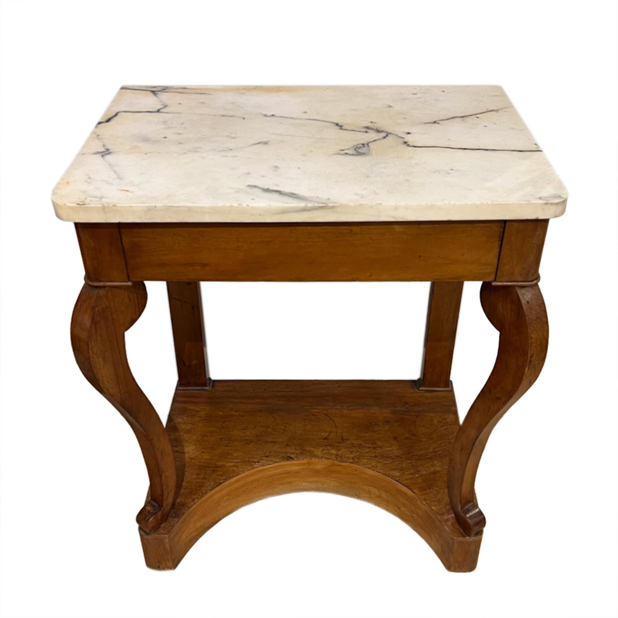 This is a lovely small antique console or side table, made in France in the mid-19th century, with a refined yet functional design. 

The top is made from polished white marble with soft grey veining, giving the piece a touch of luxury and