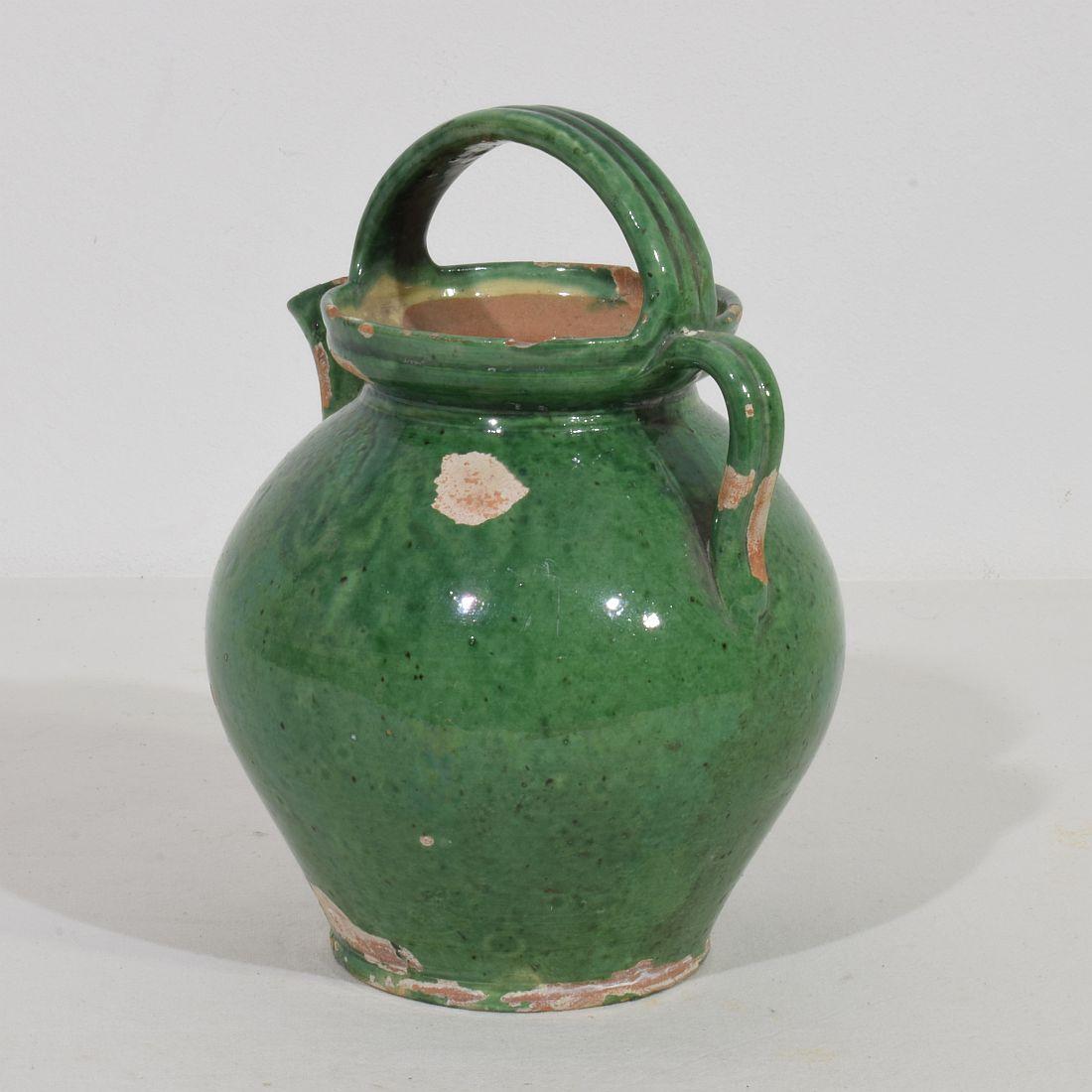 Lovely small  authentic and rare piece of pottery  from the Provence. Beautiful weathered and an amazing color. Imperfections help authenticate this water cruche as it was a utilitarian type piece, France, circa 1850.