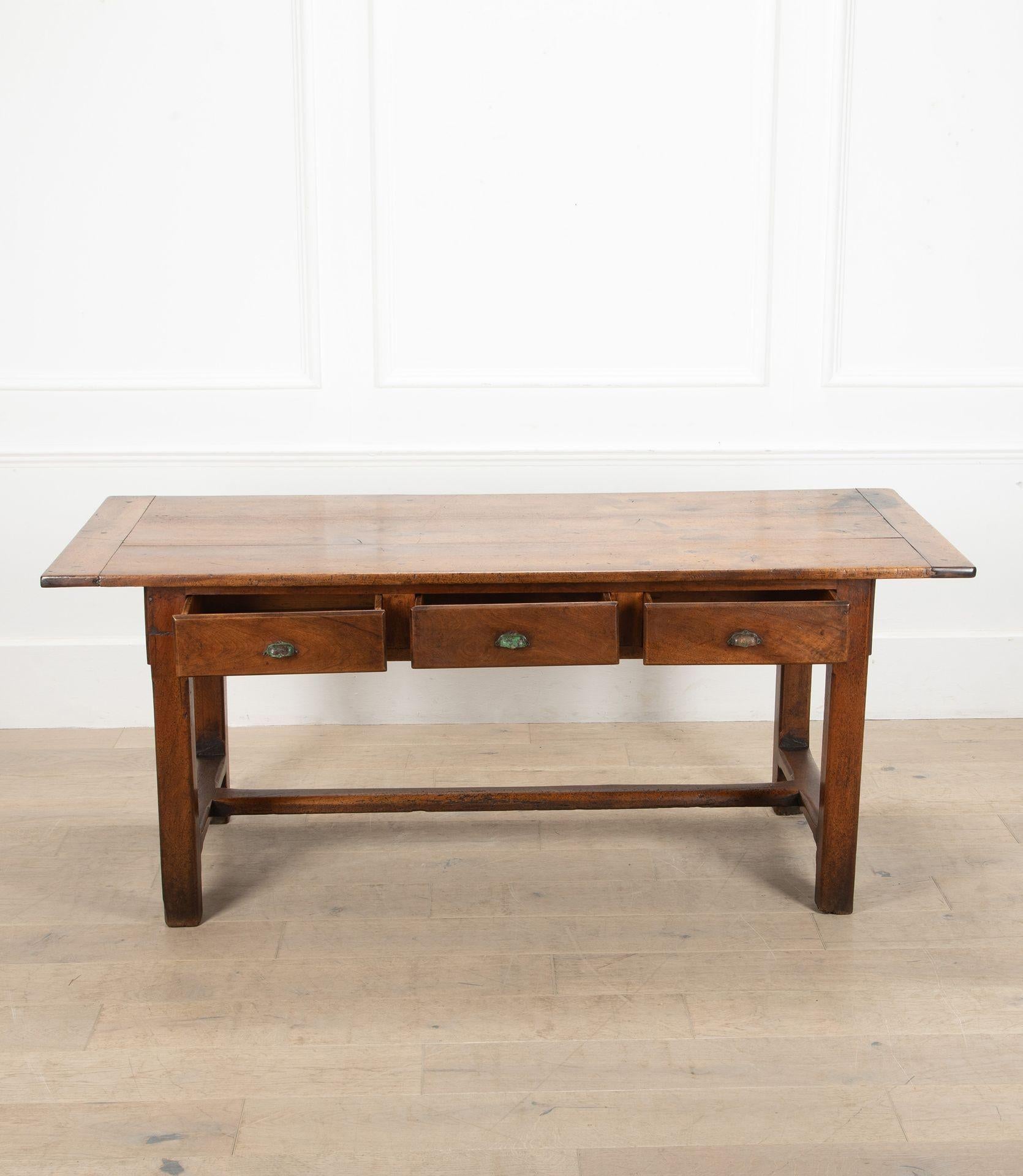 Charming example of a mid-19th Century French walnut drapers table. 
With three drawers down each side with metal cup handles. Of great colour and patina.
Circa 1850.