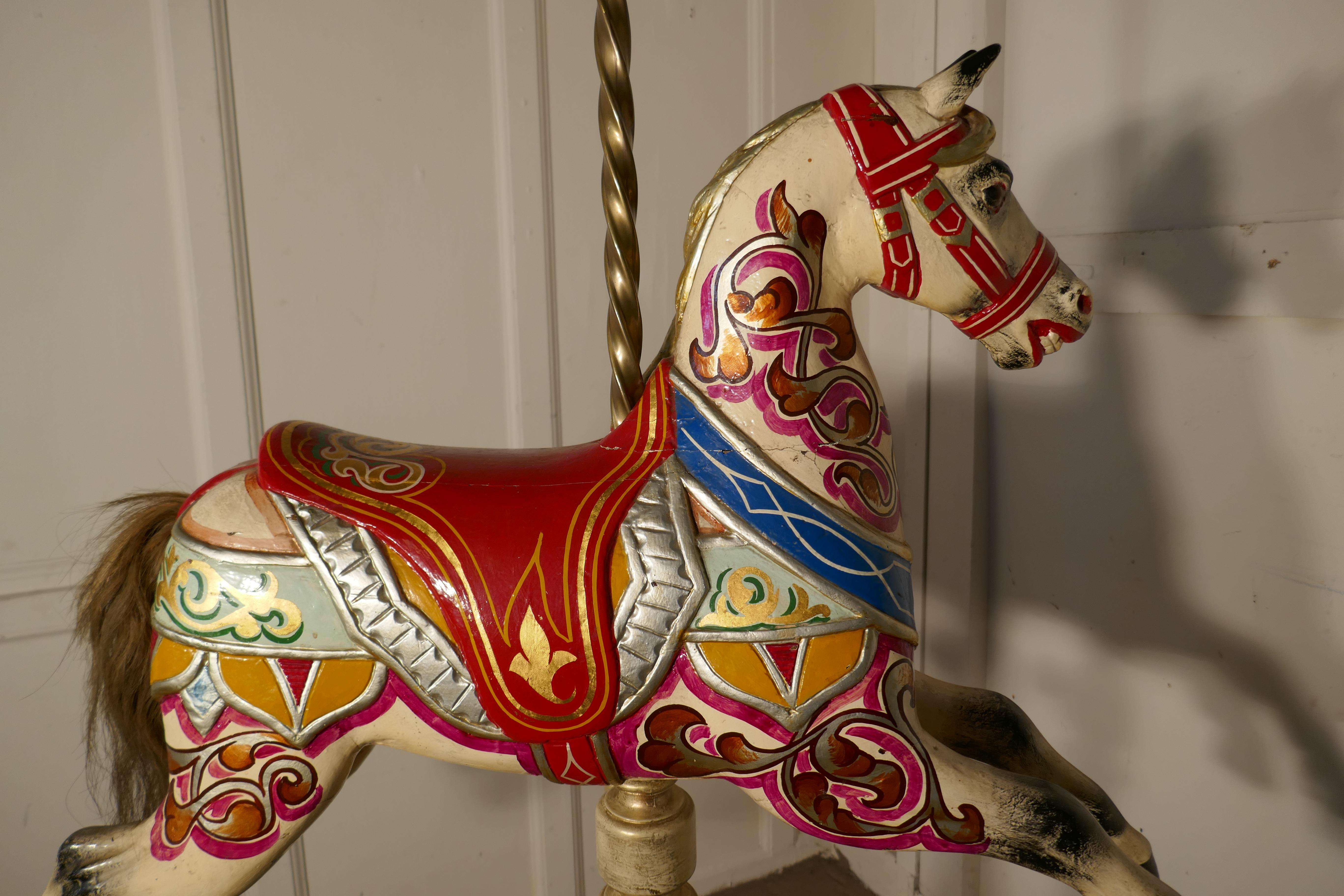 Small 19th century painted wooden carousel galloper or fair ground horse


An original the 19th century fair ground galloper, he has glass eyes and is made all in wood, the carnival paint is bright and seems to be the original design it is signed