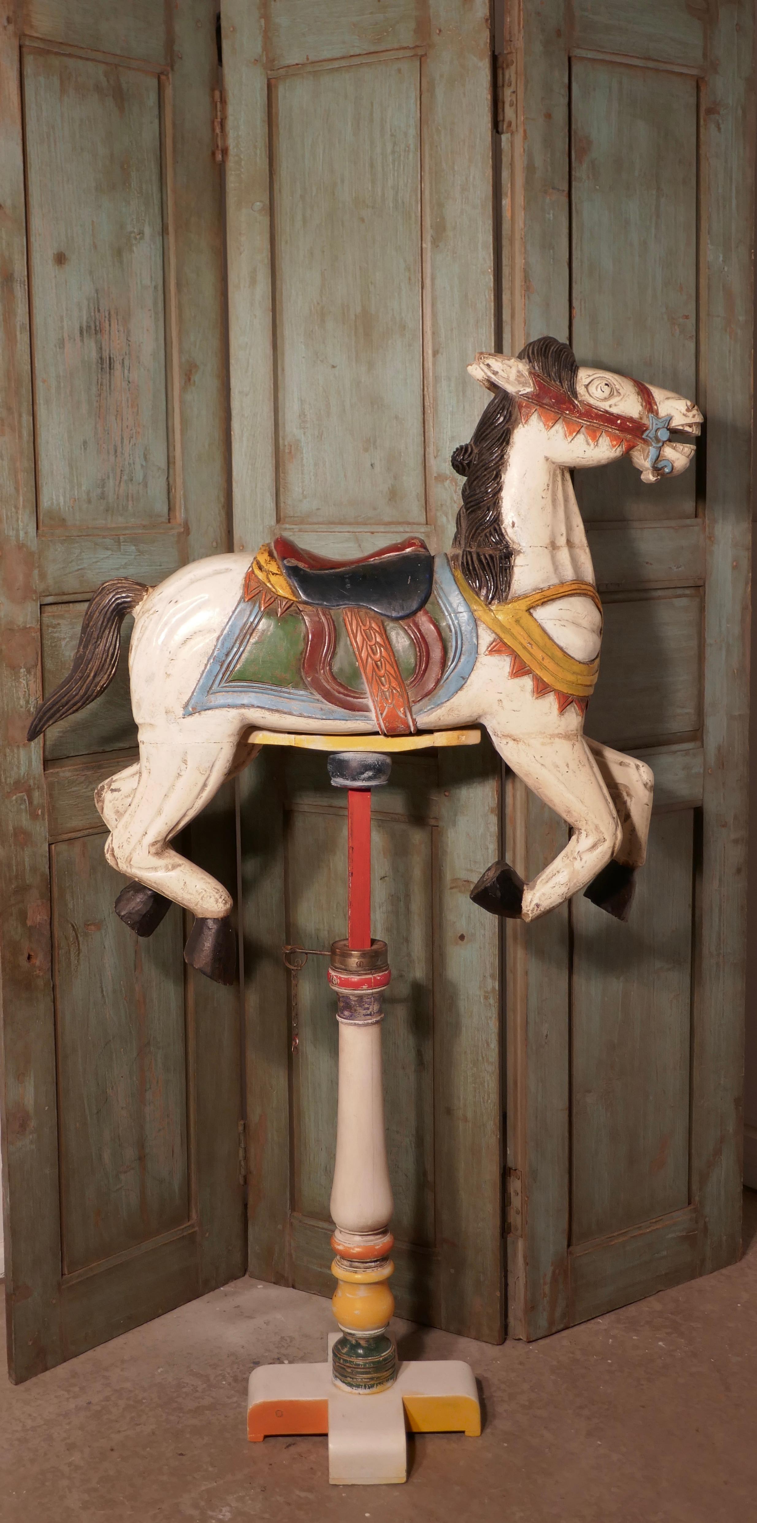 Small 19th century painted wooden Carousel Galloper or fair ground horse


An original the 19th century fair ground Galloper, he is made in wood, the carnival paint is bright and seems to be the original design 
The horse is set on an old