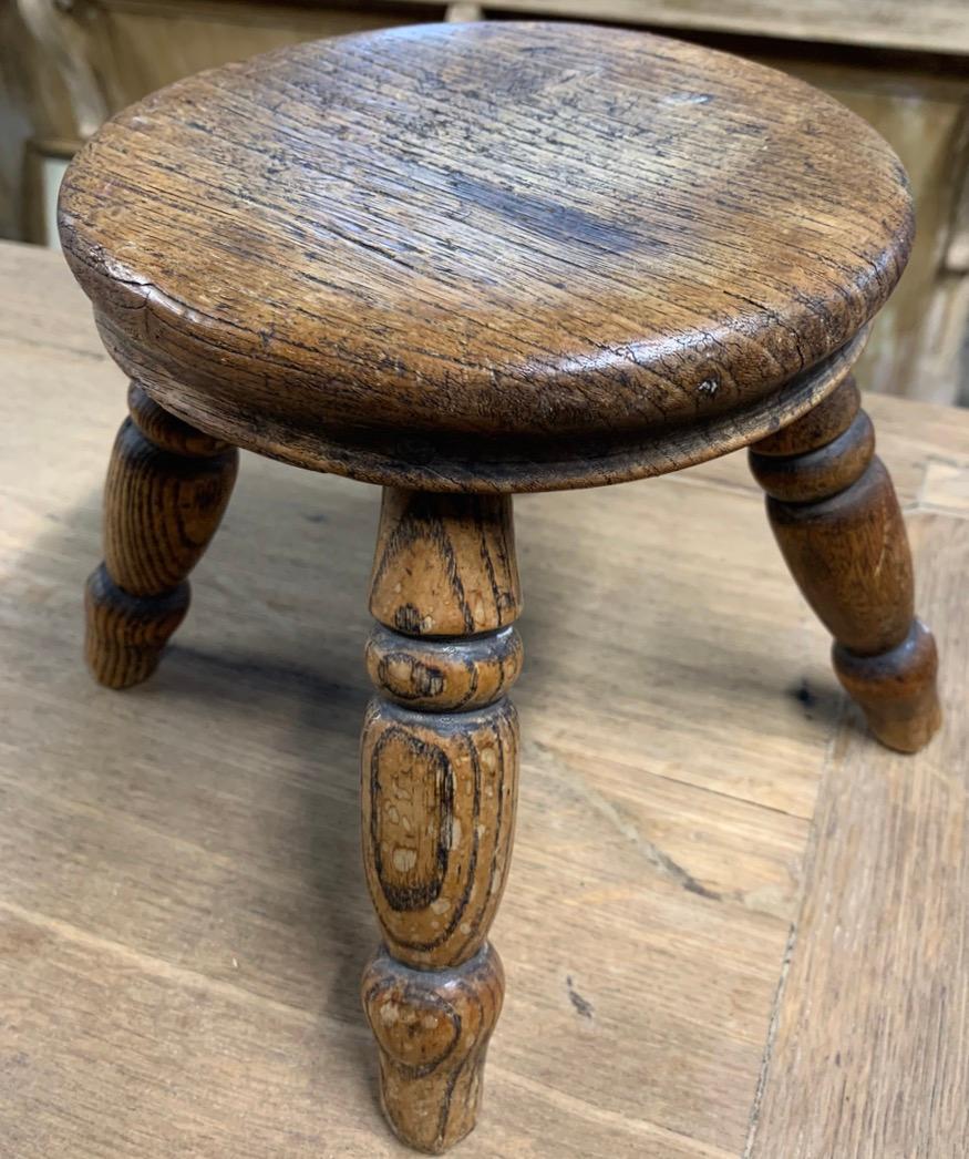 A lovely small 19th century Goat milking stool from Wales. The wood has a nice patina and is in good original condition.