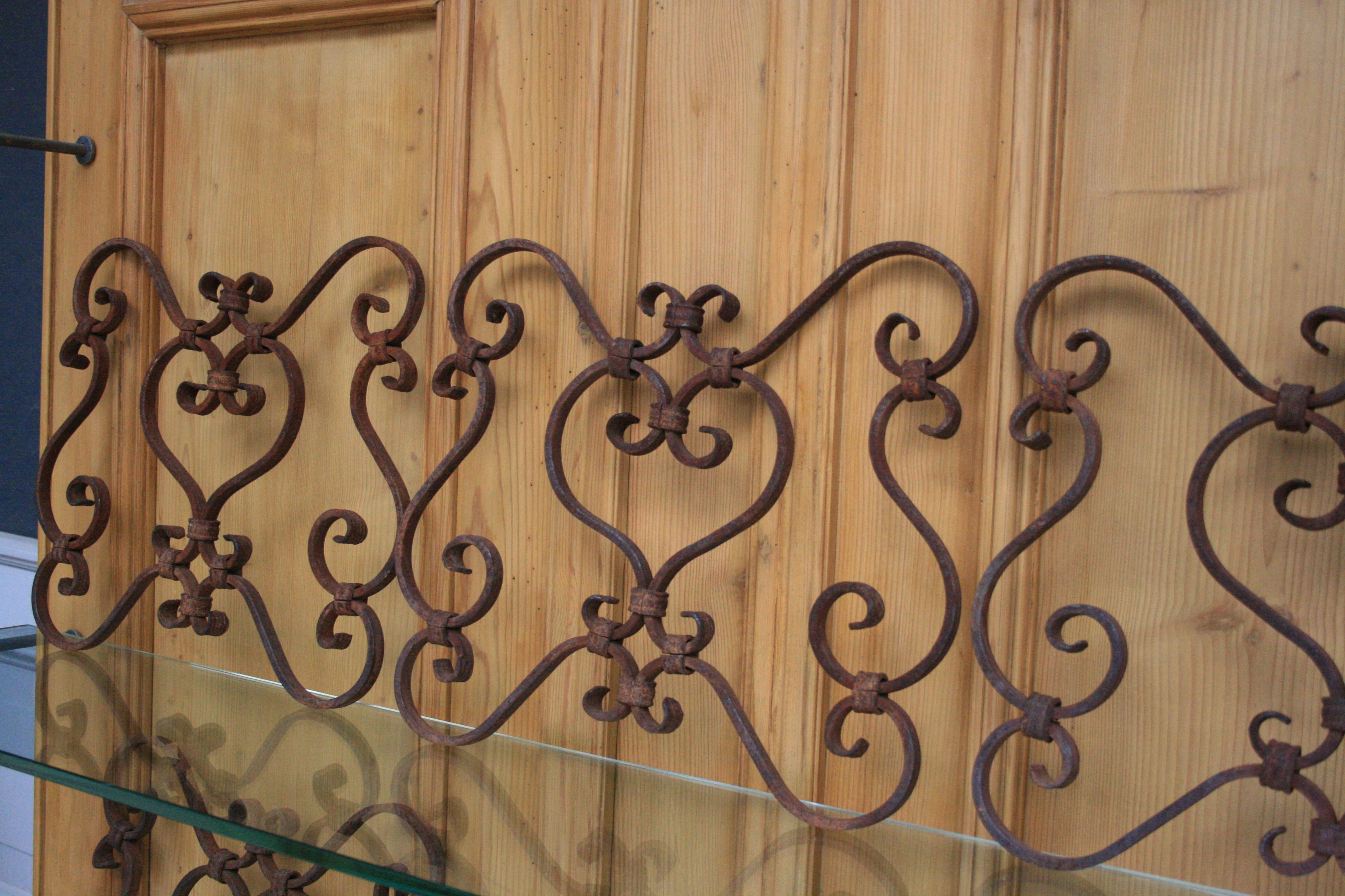 Set of 5 small architectural wrought iron window grills or grates, from the 19th century. Very decorative elements also hanging on the wall.

Dimensions:
34 cm high / 13.38 inch high,
37 cm wide / 14.56 inch wide,
2 cm deep / 0.78 inch deep.