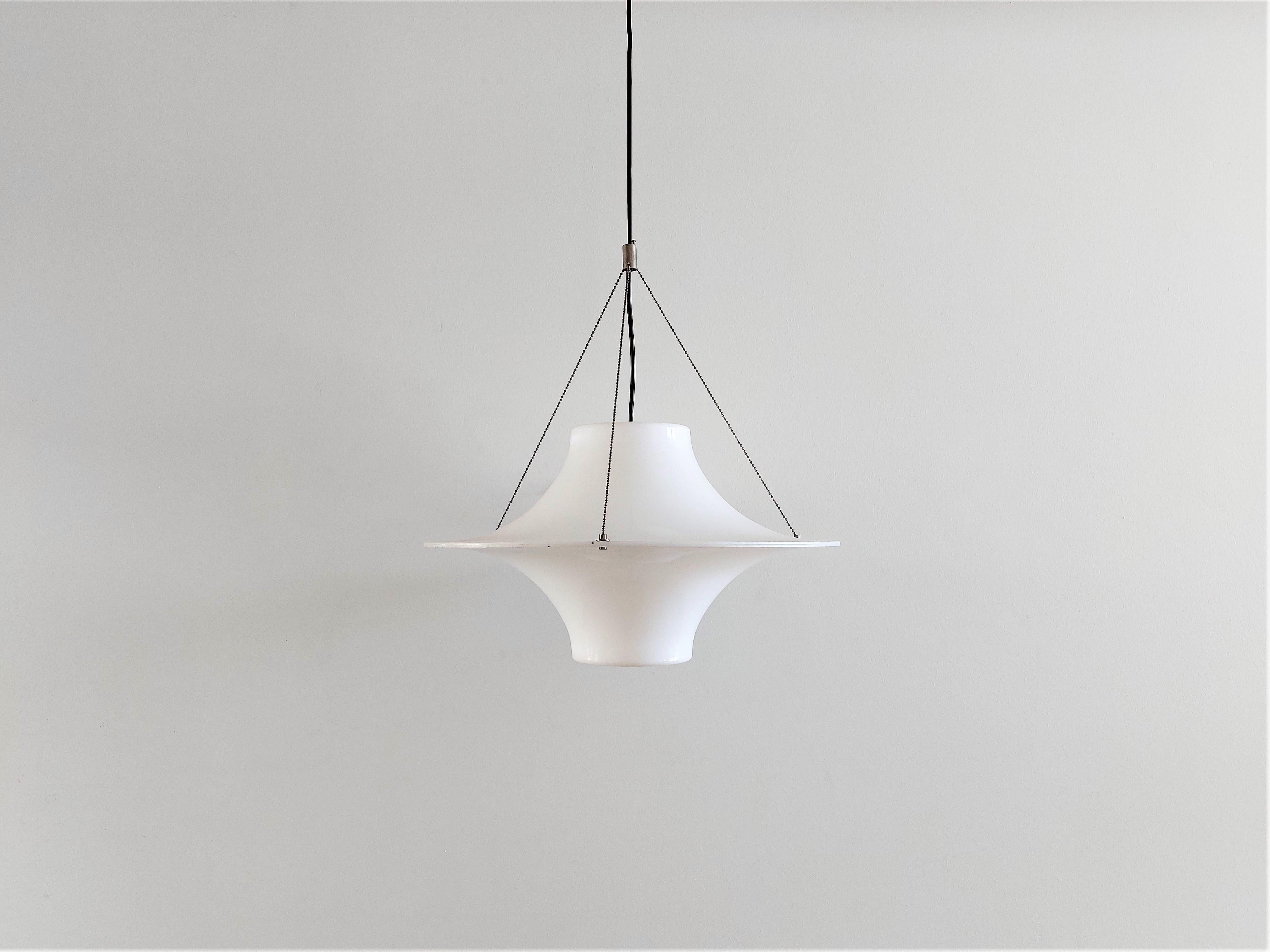 The 'Skyflyer' was designed by Yki Nummi in 1960. Yki Nummi was one of the earlier designers from Finland to use acrylic as a material for light fixtures in the 1960's. The lamp is also known as 'Lokki', that means seagull in Finnish. The shade is