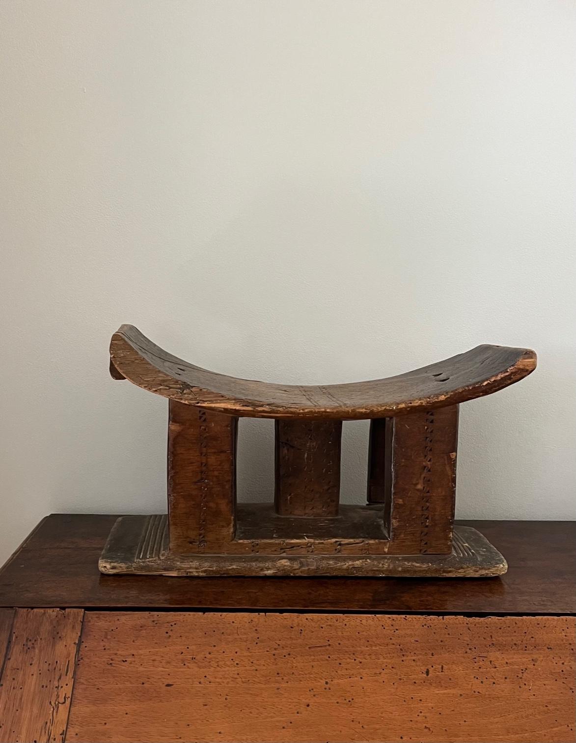 A midcentury African tribal stool. Ashanti tribe, Ghana. A wonderful genuine tribal stool which has evidently been used and not made for the tourist trade. A great decorative object.