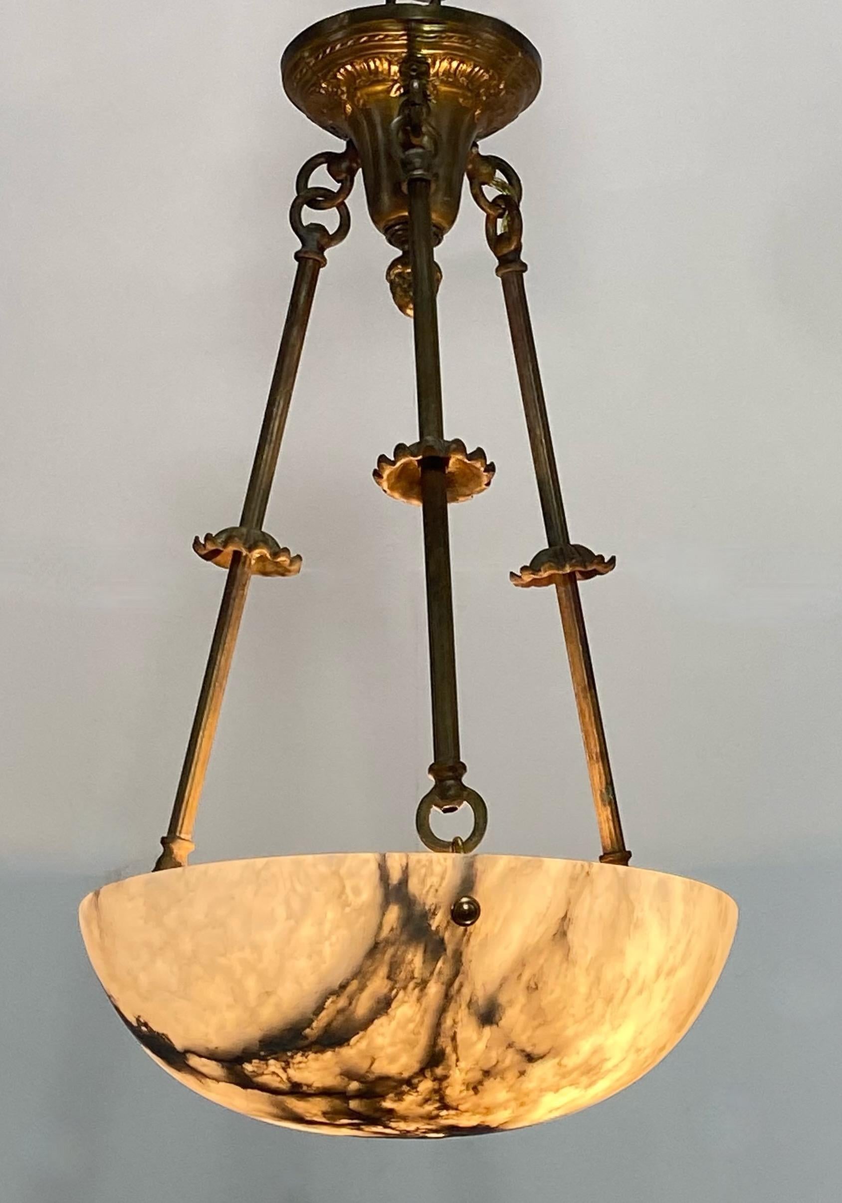 Hard to find small size alabaster pendant style ceiling light fixture with original solid brass hanger. Perfect for hallway, small room or bathroom.
Recently re-wired, holds a single standard size light bulb.
Early 20th century.