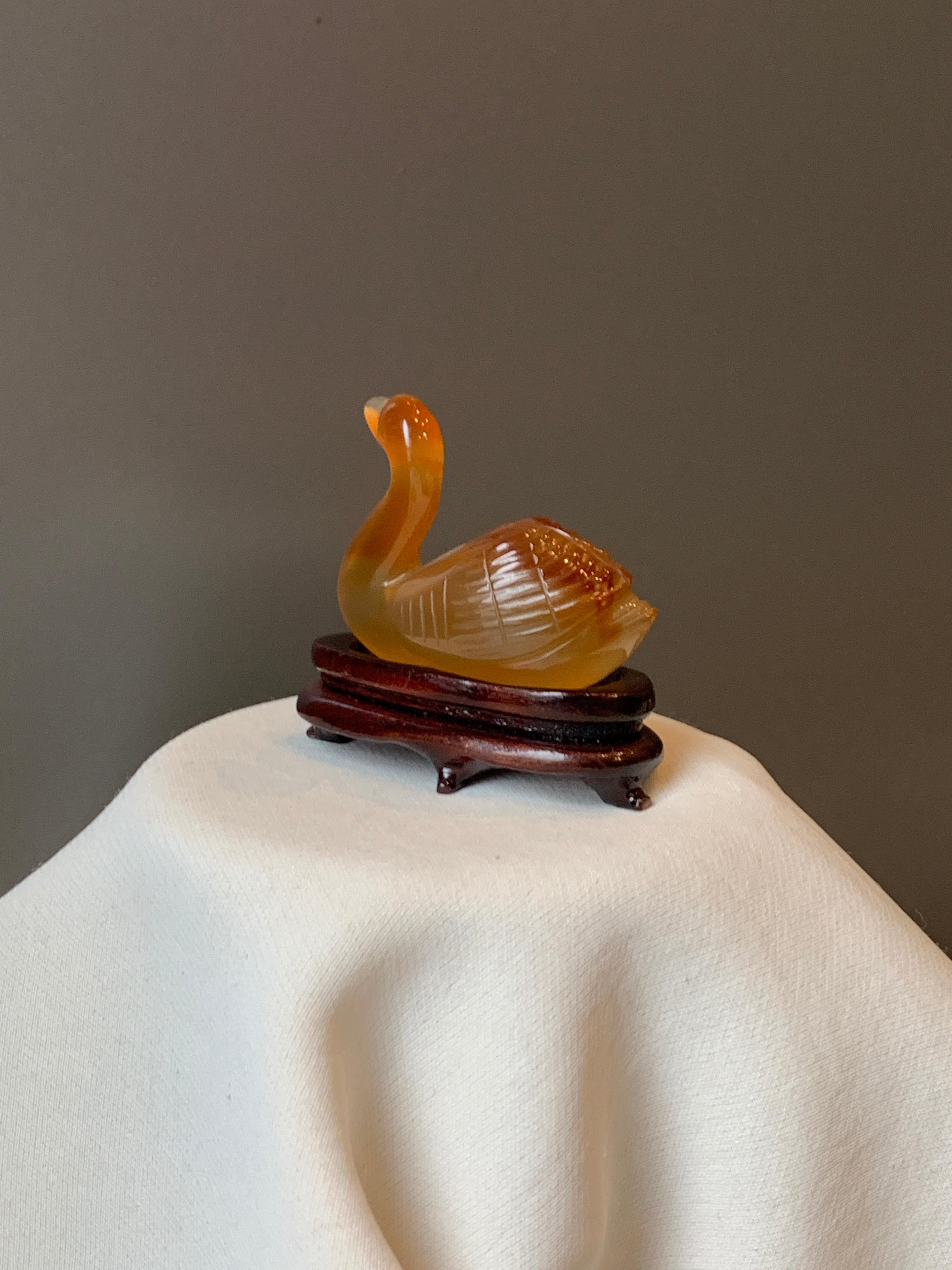 Hand-Carved Small Amber Chinese Decorative Swan on a Wooden Stand