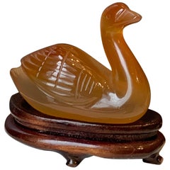 Small Amber Chinese Decorative Swan on a Wooden Stand