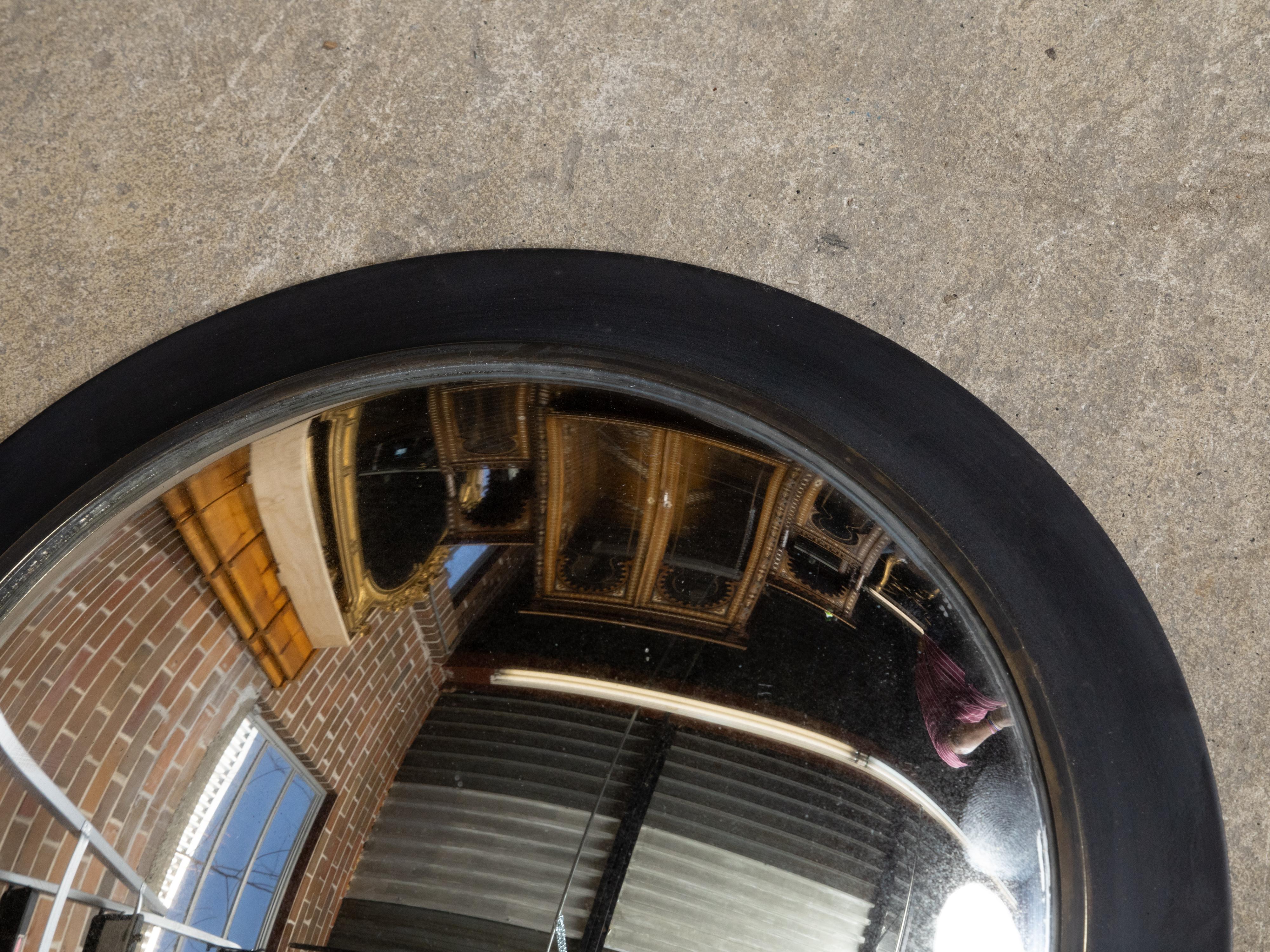20ième siècle Petit miroir convexe américain vintage avec cadre métallique circulaire noir en vente