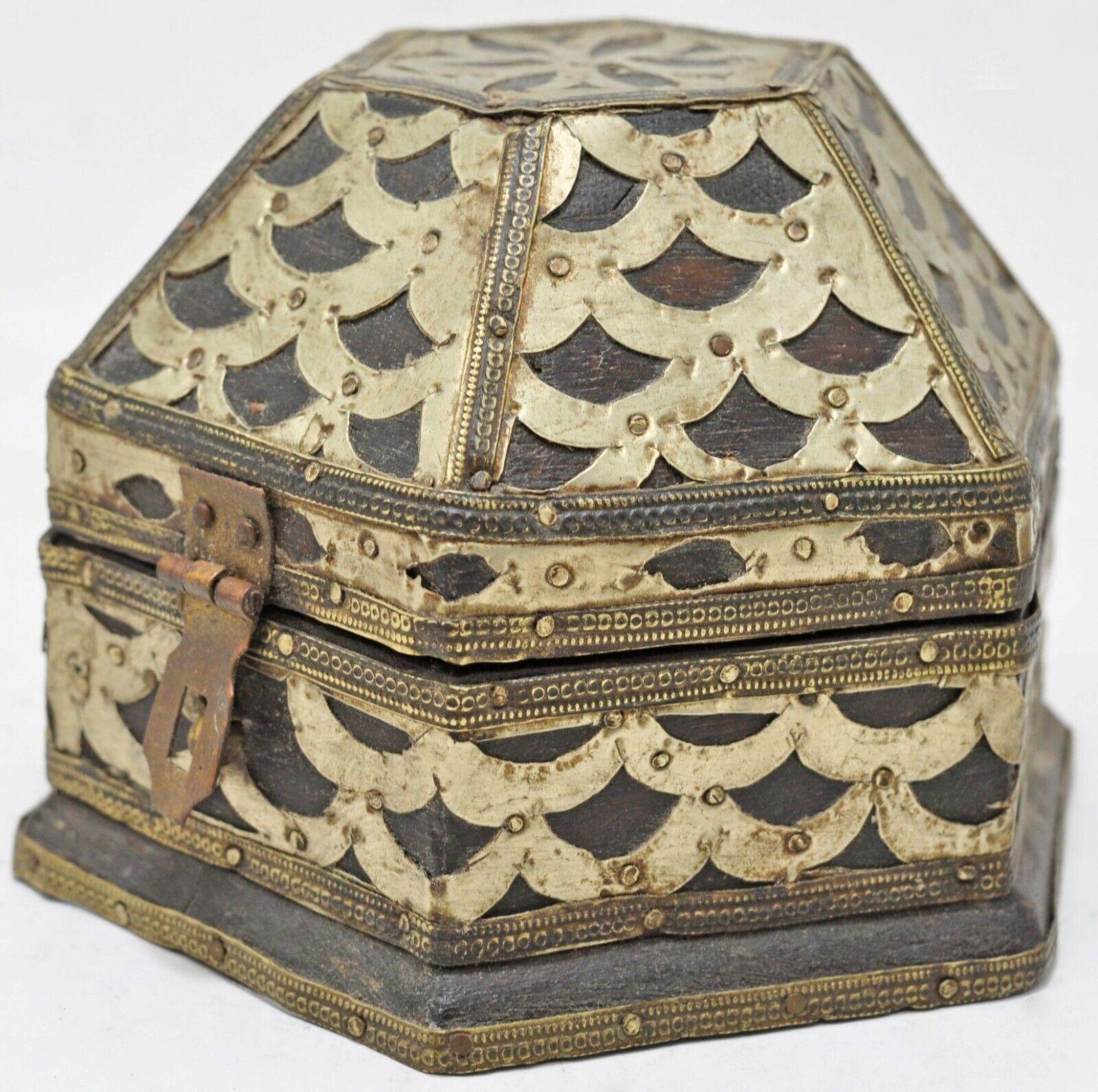 Small and elaborate Hand-Made Vintage Indian Decorative Trinket Box

Anonymous
Probably Eastern India; ca. 1900
Wood, white metal and brass

Approximate size: 4.8 x 4.4 x 3.4 in.

This early 20th century trinket box is rich in distinctive decorative