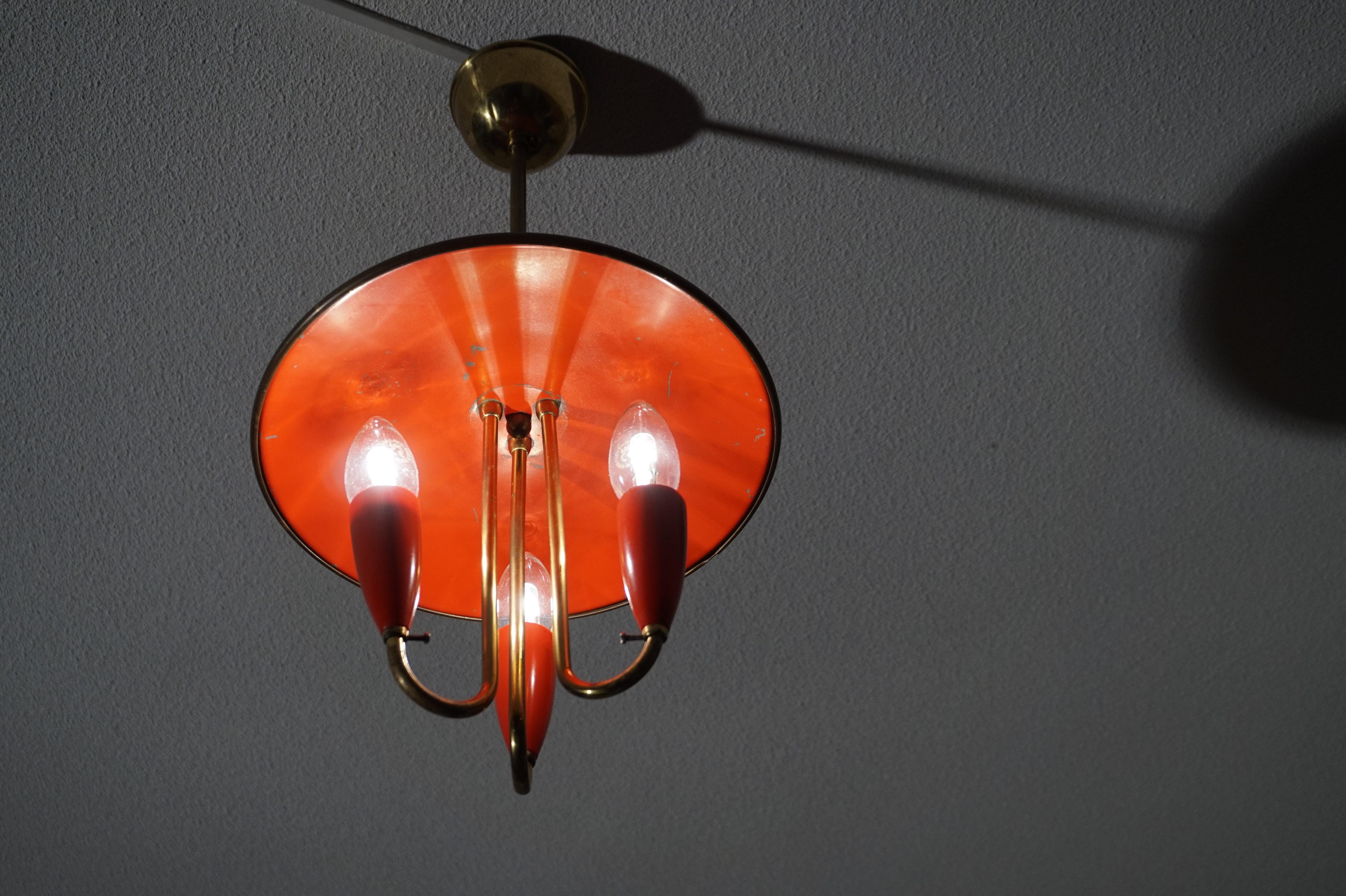 European Small and Stylish Mid-Century Modern Brass and Red Bakelite Chandelier / Pendant
