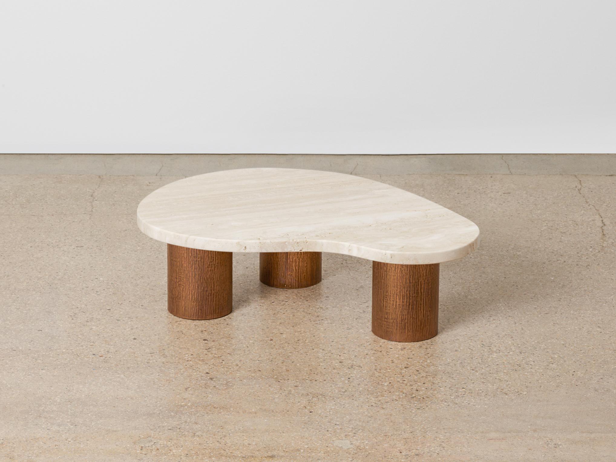 Small Andrea Nesting table by Umberto Bellardi Ricci.
Dimensions: D 74 x W 56 x H 18 cm.
Materials: Travertine, bronze legs.

Umberto Bellardi Ricci is an Italian sculptor and architect based in New York City, practicing across London, Mexico,