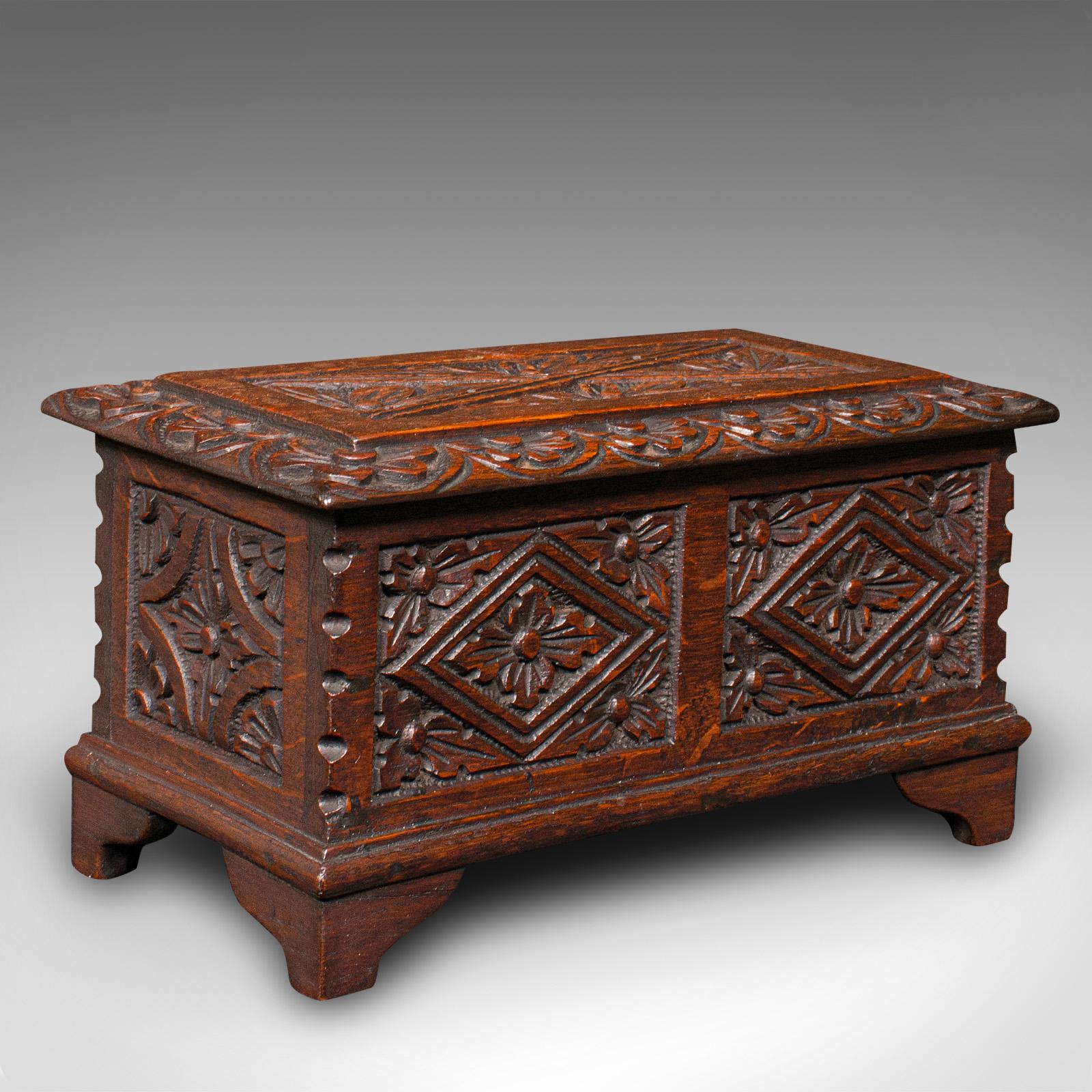This is a small antique apprentice-piece chest. An Anglo-Indian, carved teak Colonial keepsake box, dating to the late Victorian period, circa 1880.

Petite scholar's miniature coffer with accomplished carved detailing
Displays a desirable aged