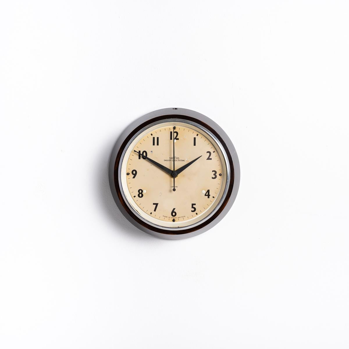 SMALL VINTAGE FACTORY WALL CLOCK BY SMITHS
A stunning find from a Brick Factory in Wales, upon conversion to living accommodation a bricked up store was discovered where 12 clocks were found. Of those 12, nine were identical Smiths English Clock