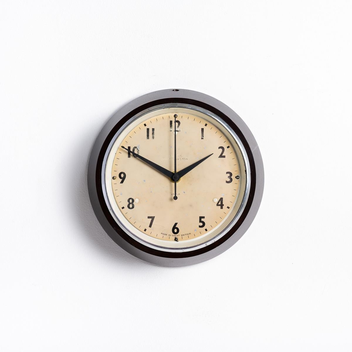SMALL VINTAGE FACTORY WALL CLOCK BY SMITHS

A stunning find from a Brick Factory in Wales, upon conversion to living accommodation a bricked up store was discovered where 12 clocks were found. Of those 12, nine were identical Smiths English Clock